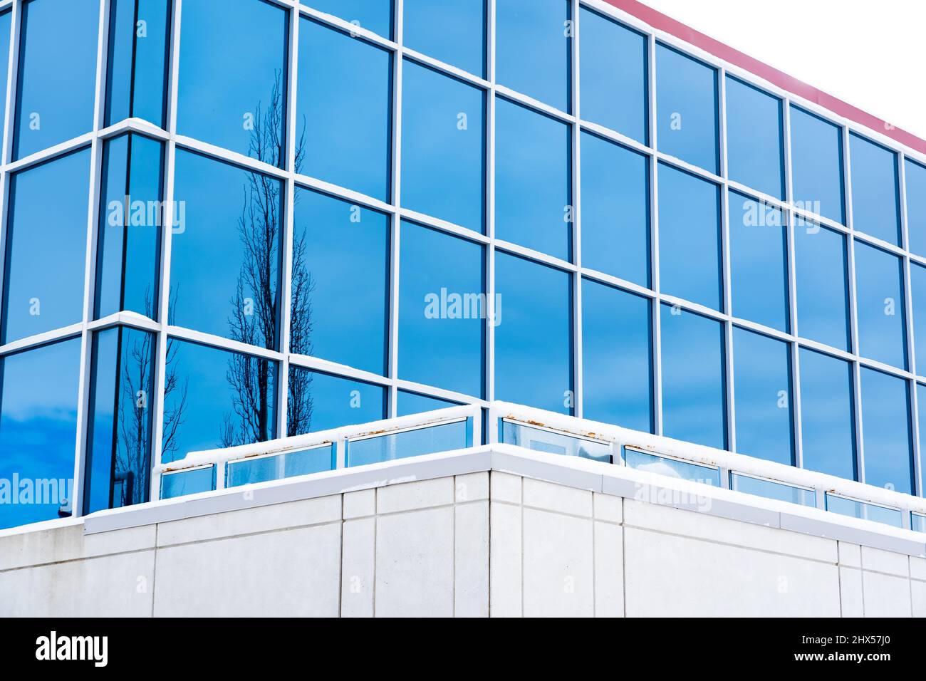 A modern building design with a concrete outdoor patio and new exterior