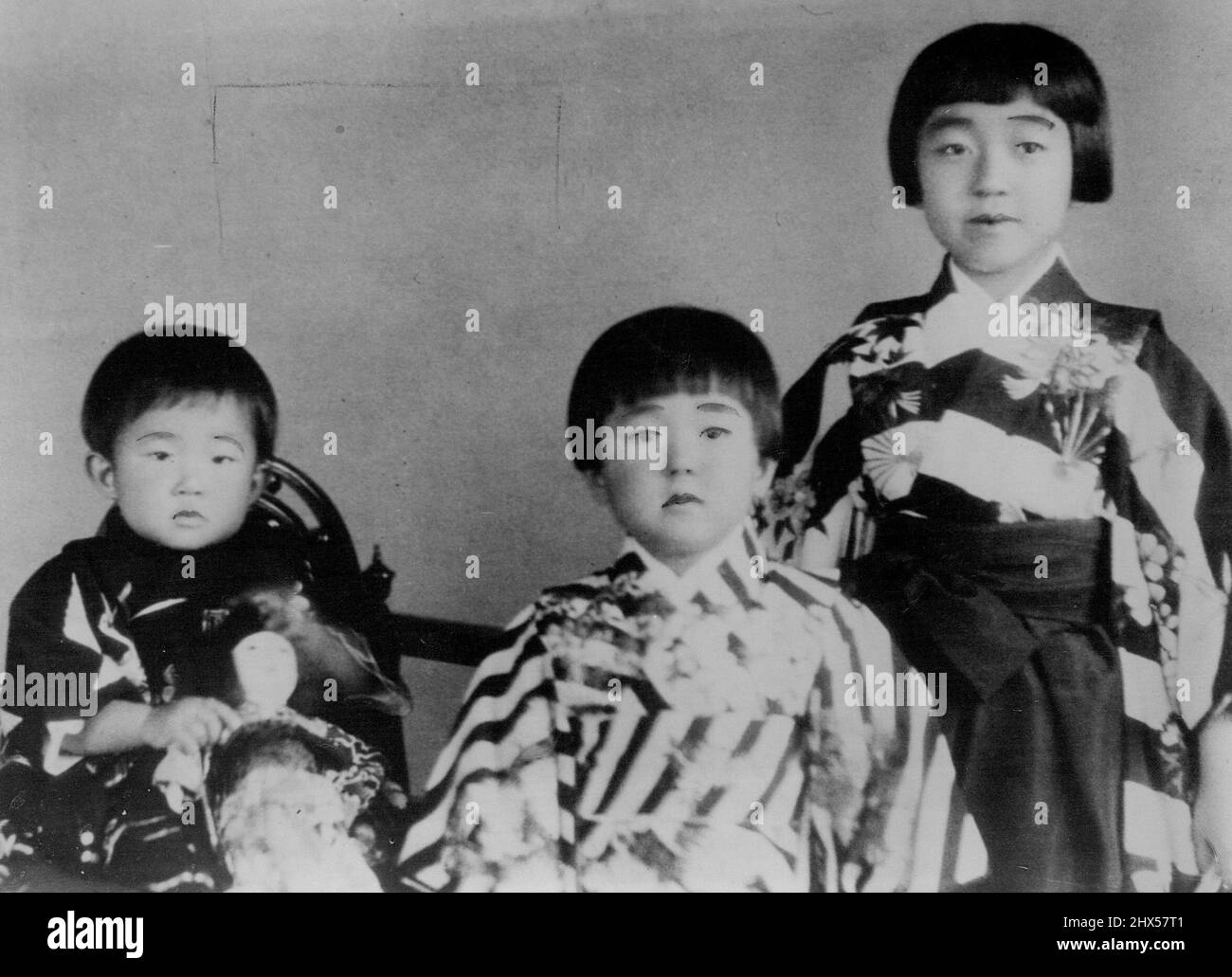 Japan's Little Princesses -- Here Are the three little daughters of Emperor Hirohito, of Japan. Left to right they are: Princess Yori, aged 2; Princess Taka, 3; and Princess Teru, aged 7. March 13, 1933. (Photo by The Associated Press Ltd.). Stock Photo