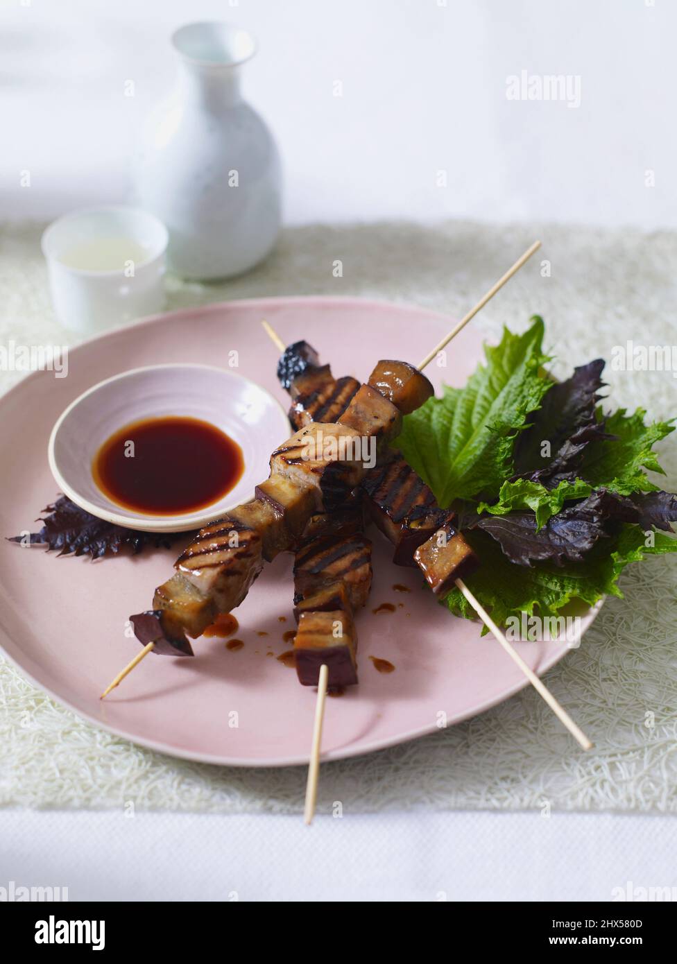 Tuna and aubergine yakitori skewers with soy dipping sauce Stock Photo