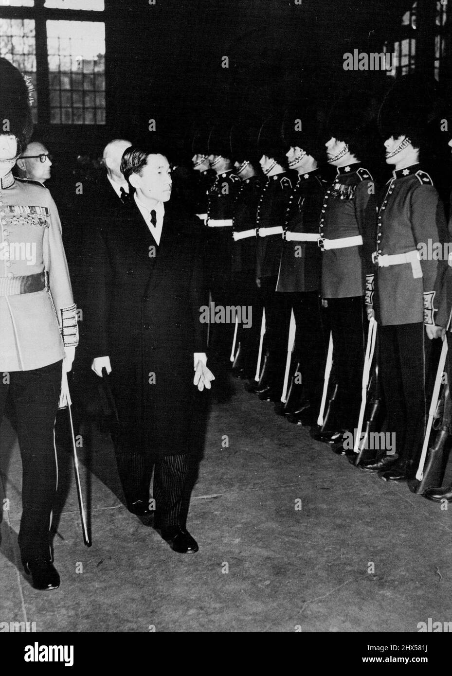 Prince Akihito Of Japan's Tour Of Canada -- Prince Akihito of Japan inspecting the Guard of Honour of the Governor General's Footguard, on his arrival at Union Station, Ottawa. Prince Akihito of Japan on his arrival at Government House, Ottawa, was greeted by the Hon. Vincent Massey, the Governor General of Canada. April 27, 1953. (Photo by Fox Photos). Stock Photo