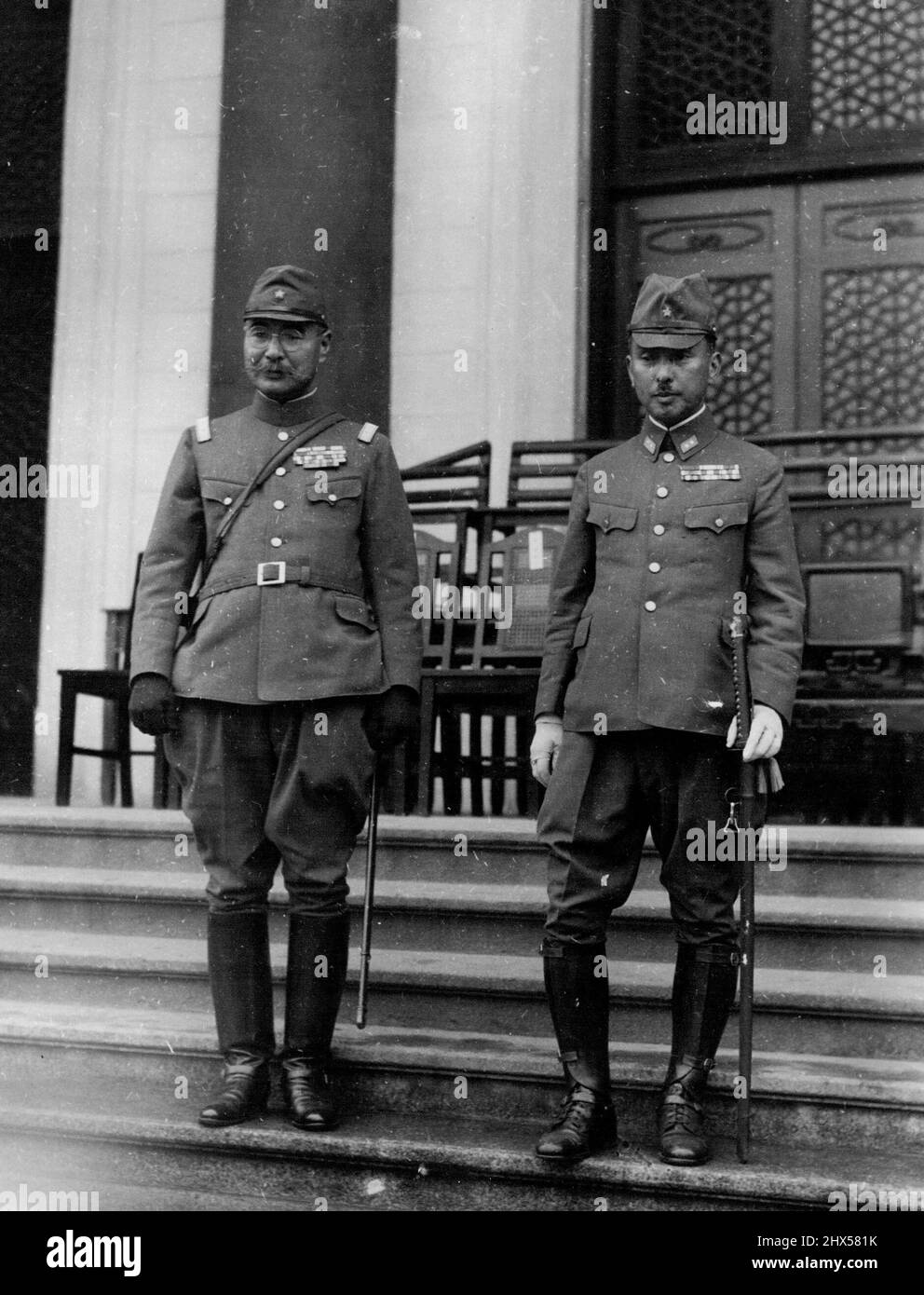 Prince Visits Canton.... Lieutenant-General Prince Yasuhiko Asaka, right, poses with Lieutenant-General Riichi-Ando, commander of the Japanese army in South China during a recent visit in Canton. His Highness returned to Japan yesterday after a three-week tour of war fronts in China. April 14, 1939. (Photo by The Domei News Photos Service). Stock Photo