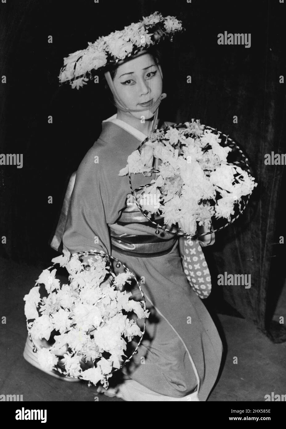 Japanese Ballet Rehearsal -- Members of the Japanese Ballet Company that are to appear at the Princes Theatre in London were to-day at rehearsals at that theatre. This photograph taken there ***** morning shows one of the ballerinas, Masako Okado makes a pretty picture during her rehearsal. November 03, 1954. (Photo by Daily Mail Contract Picture). Stock Photo