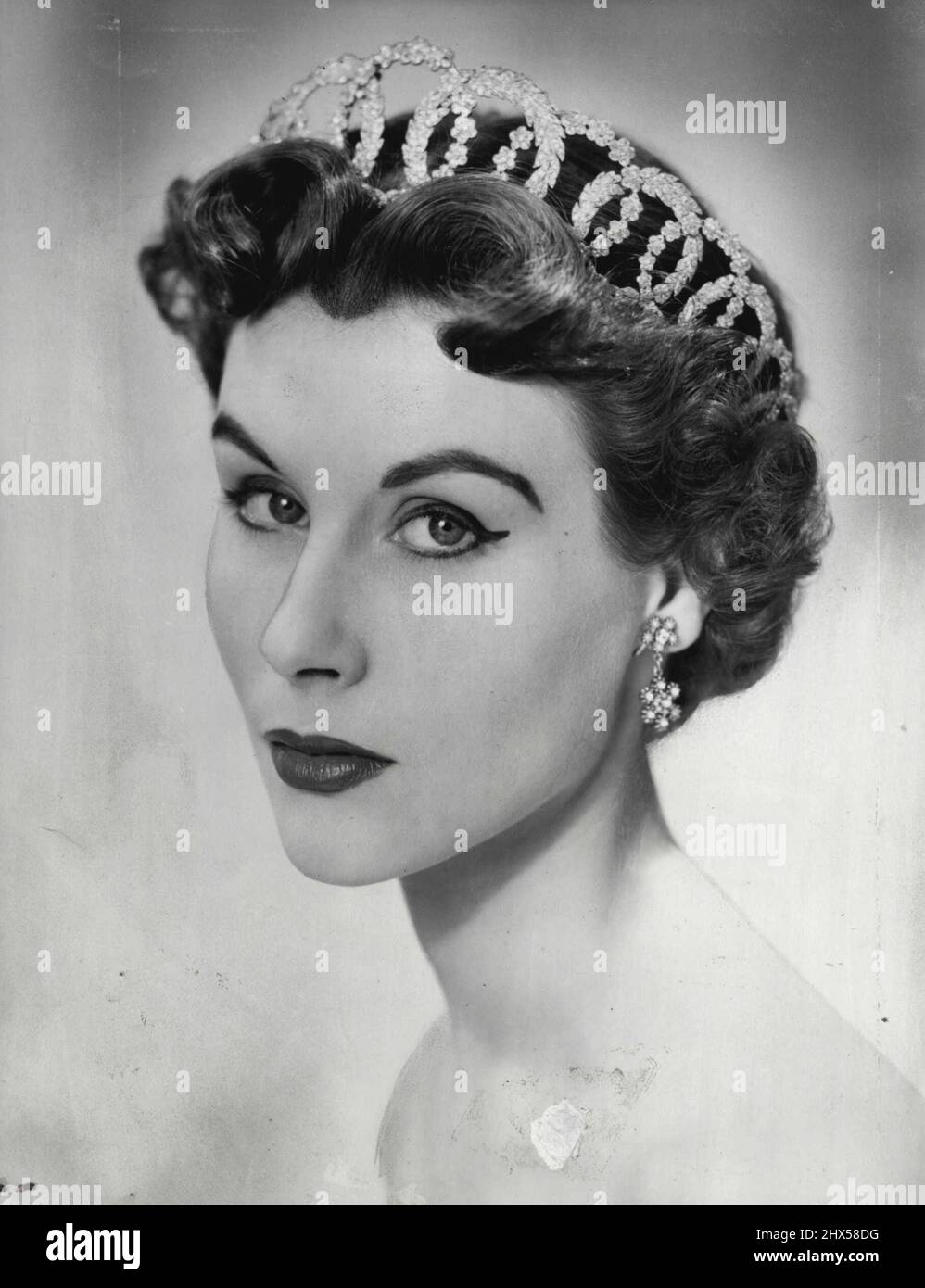 Boucheron designed this tiara to be worn with a centre parting. March 9,  1953. (Photo by A Bassano Picture Stock Photo - Alamy
