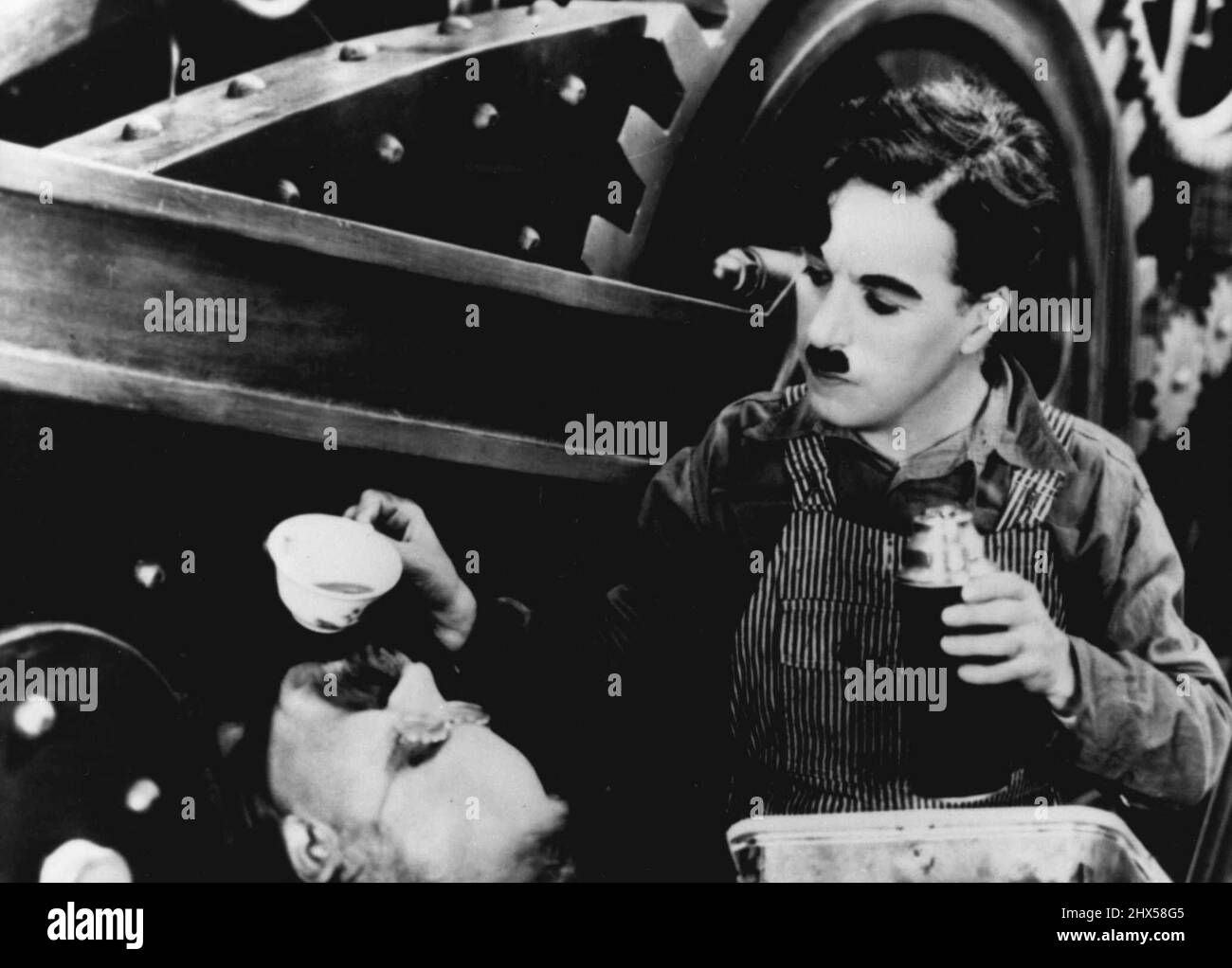 Charlie Chaplin - Actor. Born Britain. In scene from the 1936 film ...