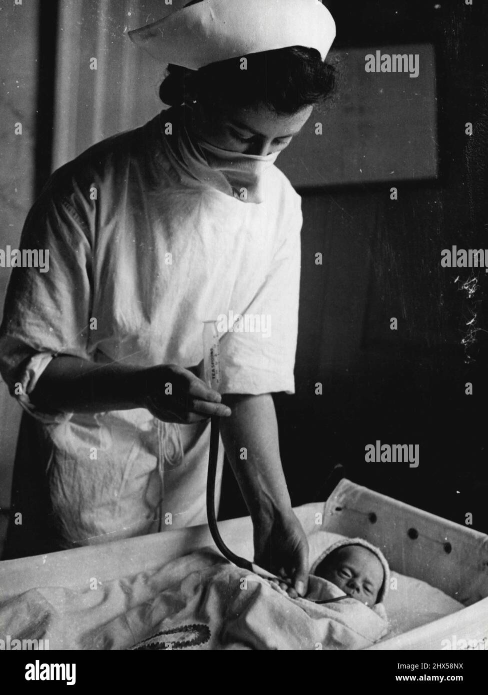 Mansion Maternity Home Student midwife feeds a prematurely born