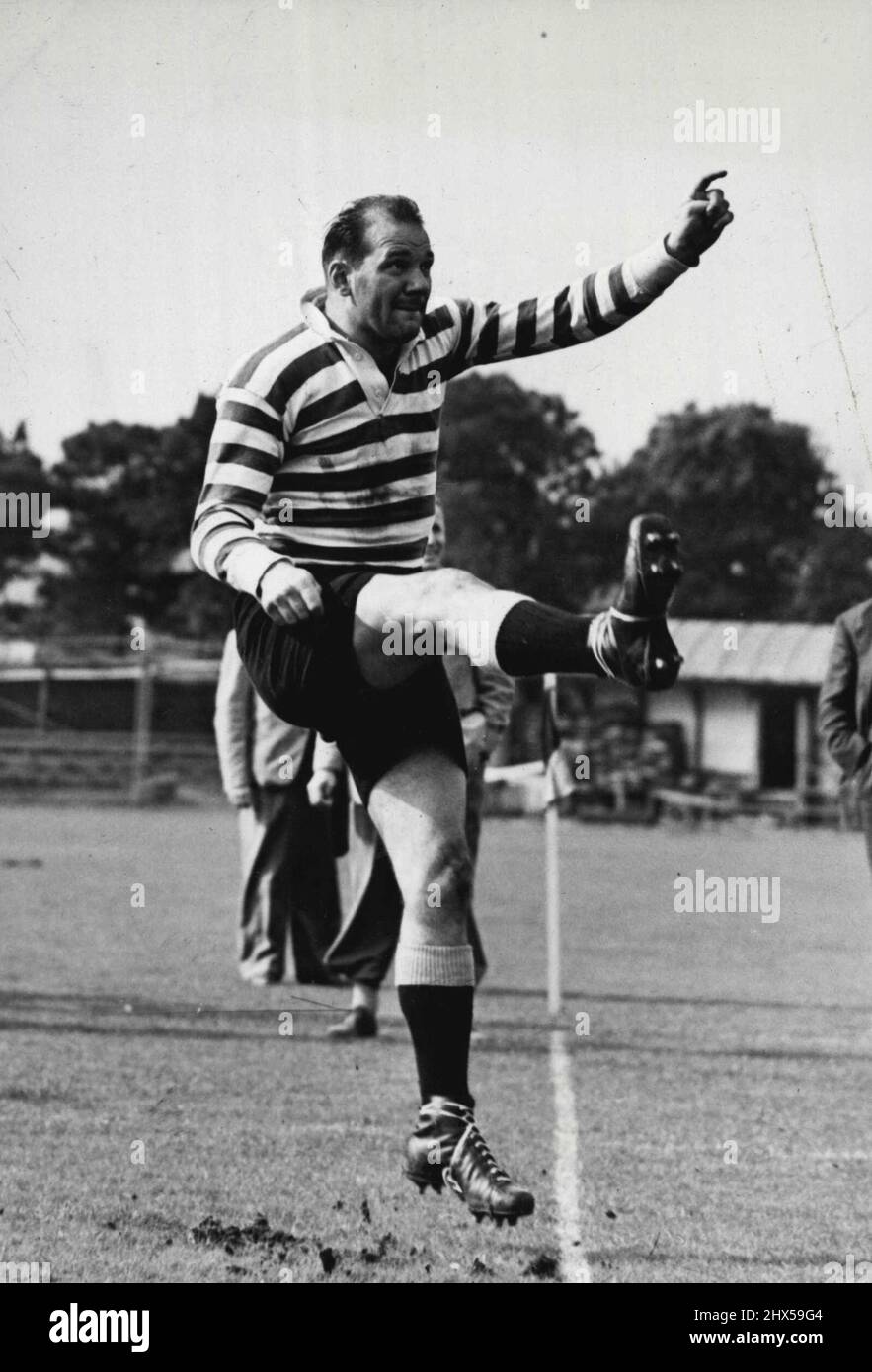 Springbok Limbers Up -- Taking a vigorous kick during training at Dean Park is F.P. (Buks) Marais, the Springboks wing three-quarter. In training at Dean Park, Bournemouth for the first game of their tours against the South-Eastern Counties on October 10, is the South African Rugby Union team, here for the first time since 1931. October 02, 1951. (Photo by Fox Photos). Stock Photo