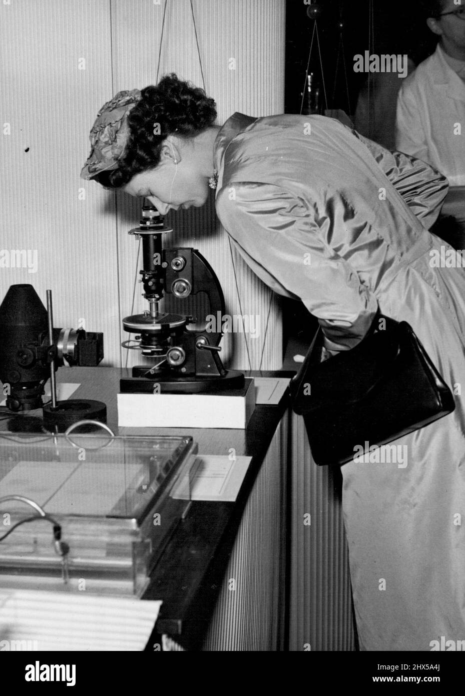 The Queen Visits Hammersmith Hospital Closing one eye, H.M. The Queen