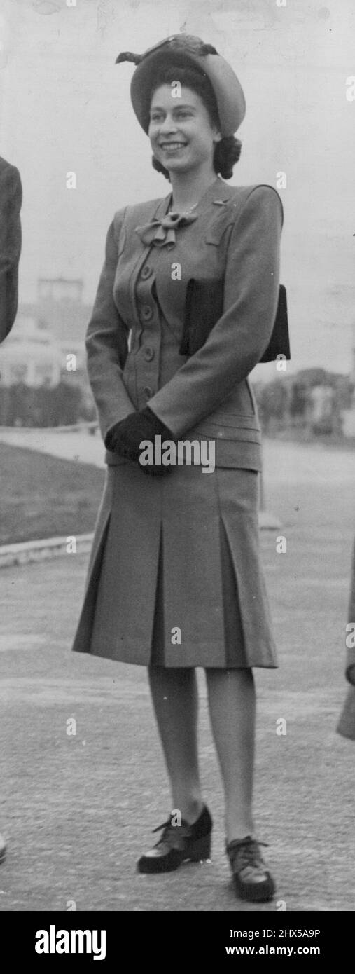Princess Margaret Flies To N. Ireland - H.R.H. Princess Elizabeth wore a pale sapegreen suit and hare hat to match, with brown accessories when she said goodbye to Princess Margaret at London Airport to-day (Tuesday). The panelled jacket had an unusual false-bolero effect and the pleated skirt showed no tendency towards the recently announced 'London Line'. H.R.H. Princess Margaret left London Airport by air for Northern Ireland this afternoon (Tuesday), and was bid farewell at the Airport by her sister H.R.H. Princess Elizabeth. October 14, 1947. Stock Photo