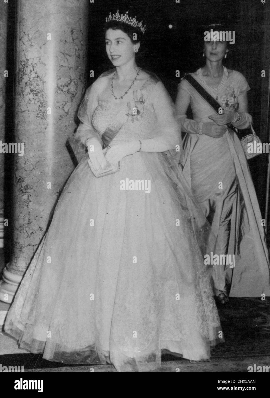 Princess Elizabeth Wears A Crinoline At Government Reception - Princess Elizabeth, wearing a Crinoline and a coronet, followed by the Duchess of Kent at Lancaster reception. This reception was the last function to be attended by King Frederik and Queen Ingrid of Denmark before their return home at the end of their State Visit to Britain. May 10, 1951. Stock Photo