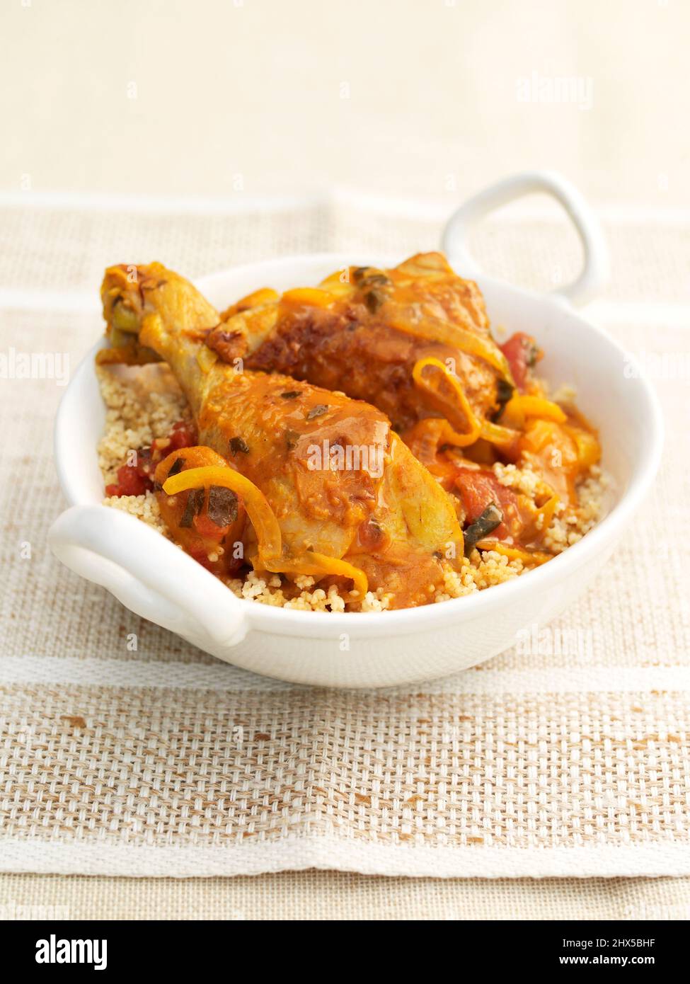 Moroccan chicken with couscous, served in a bowl Stock Photo Alamy