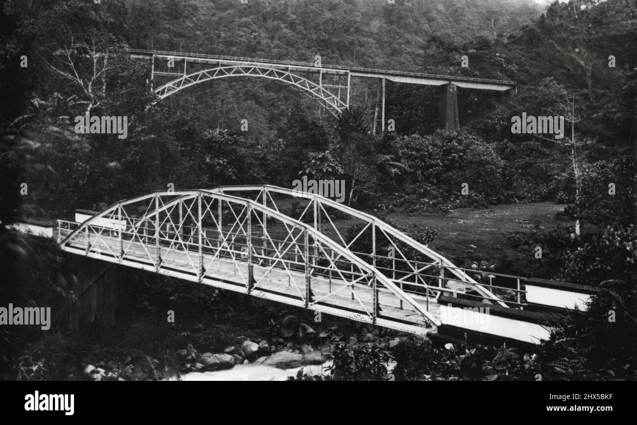 West Central Sumatra -- Railroads and traffic bridge, in the Anei Canyon, Padang Highlands, between Padang and Fort de Kock. March 31, 1950. Stock Photo