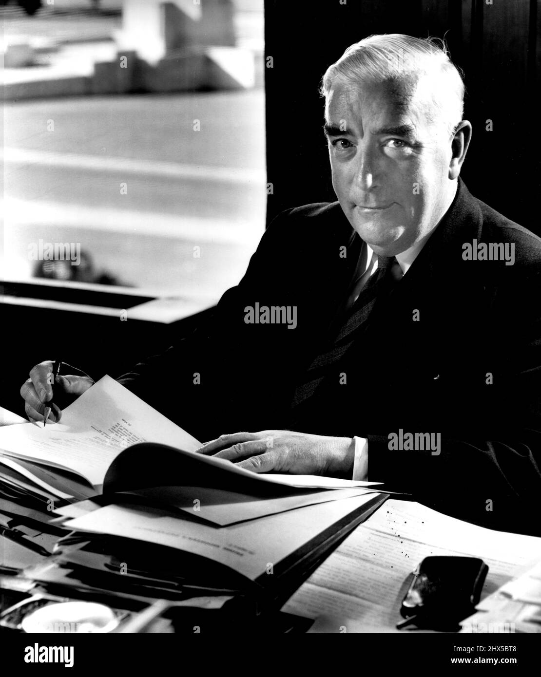 [Sir] Robert Menzies, at Parliament House, Canberra for The Times, London. Sir Robert Menzies (1894-1978) served twice as Prime Minister of Australia: from 1939 to 1941 as leader of the United Australia Party and from 1949 to 1966 as leader of the Liberal-Country Coalition. Max Dupain and Kerry Dundas travelled to Canberra to photograph Menzies after his election for his second term as leader of the Liberal-Country Coalition. Menzies retired in 1966 and was succeeded by Harold Holt. November 1, 1951. (Photo by Max Dupain). Stock Photo