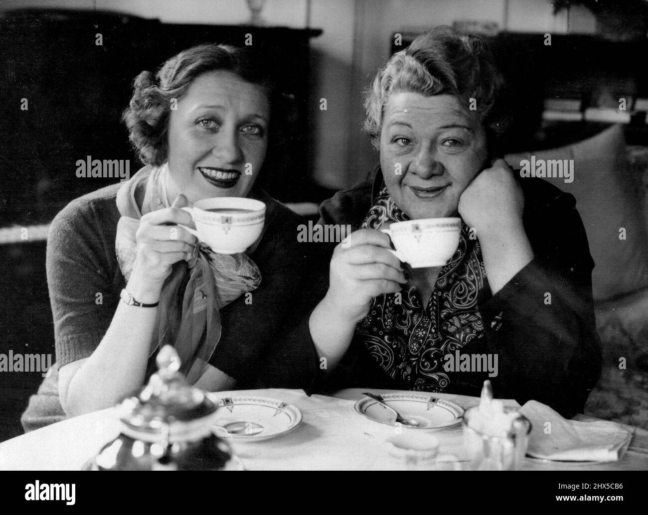 15 Years Ago ***** tucker gave Ruth Etting her first chance in a show, now after all this time a reunion has been staged between these two famous radio stars. A cup of tea was the medium. October 1, 1936. (Photo by Universal). Stock Photo