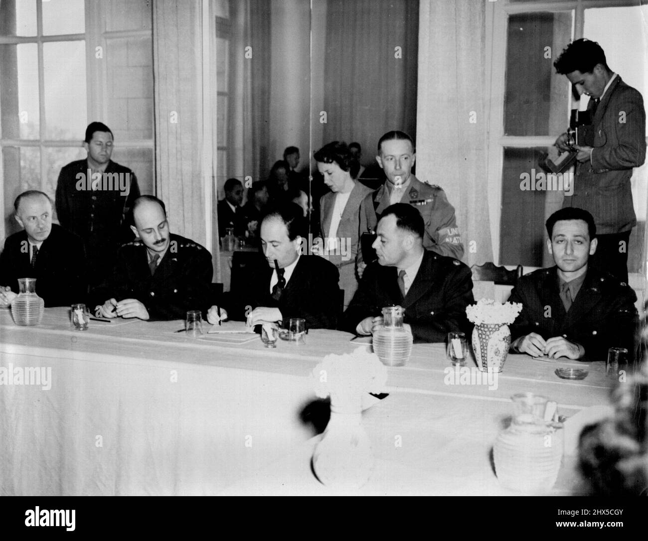 Eytan Signs Rhodes treaty -- Dr. Walter Eytan (seated, center) Director General of the Israeli Foreign office, signs the ***** in the *****. January 01, 1949. (Photo by Associated Press Photo). Stock Photo