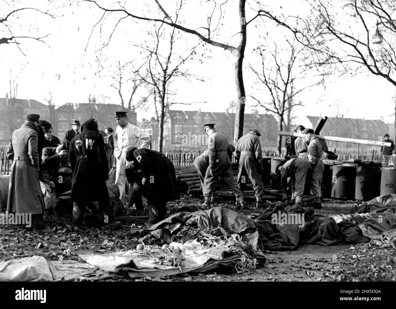 Military Camp at Clapham Common Troops and German P.O.W.'s fitting up field kitchens on Clapham Common today. Troops and German Prisoners-of-war, set up a complete Army ***** from which will be directed the ***** to feed London, during the present strike. January 30, 1941. (Photo by LNA) Stock Photo