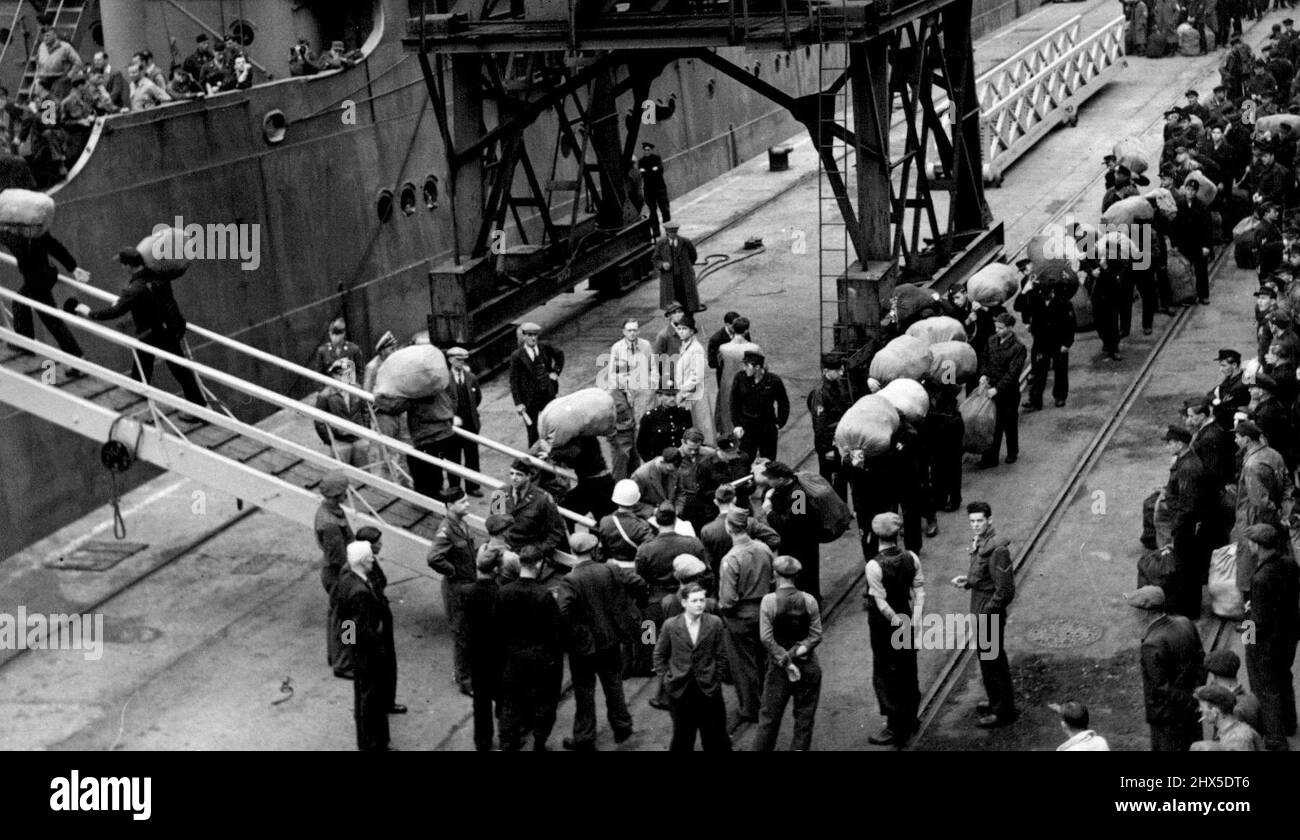 German POW's Repatriated - The POW's are seen embarking at Southampton in the U.S. transport James W. MacAndrews, bound for Bremerhaven. All were wearing left-off U.S. Army clothing. More German prisoners of war - 437 of them, sailed for home yesterday. They took gifts of soap and coffee with them, items which are practically non-existant in Germany. October 04, 1946. Stock Photo