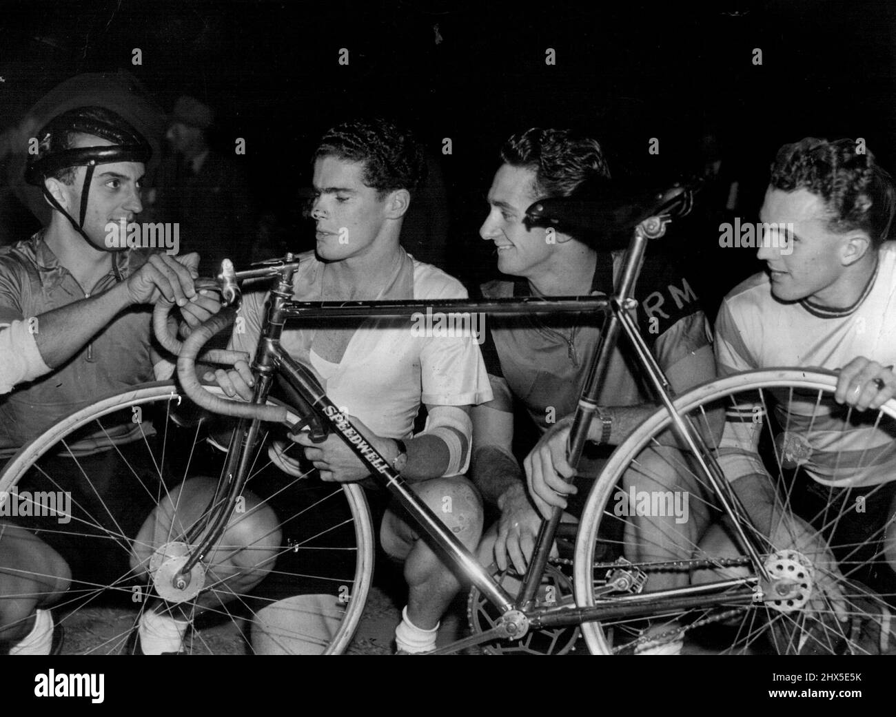 ***** four cyclists are almost certain to represent NSW in the Australian championships ***** Resting between races at Wiley Park last night, left to right, Charlie ***** Australian Olympic and Empire Games representative, John Tressider, Australian 1000 ***** sprint champion, Roy Moore Australian five-mile junior record holder, and Lionel Cox, Australian one-mile champion. January 13, 1952. Stock Photo