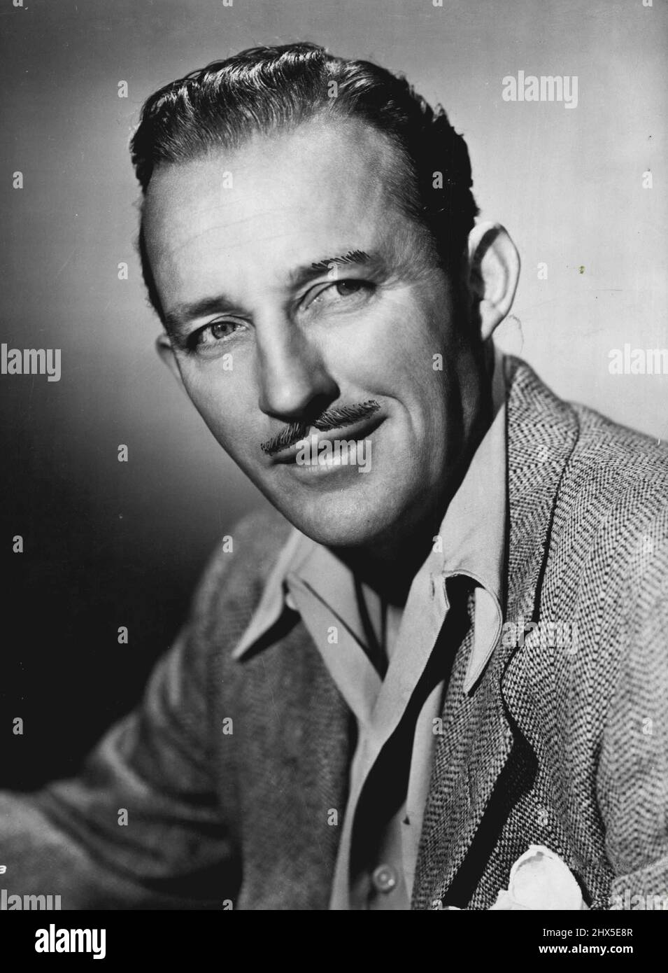 Bing Crosby -- 'I admit my upper lip has a wrinkle here and there, but let's keep it clean. October 22, 1953. (Photo by G. K. Austin) Stock Photo