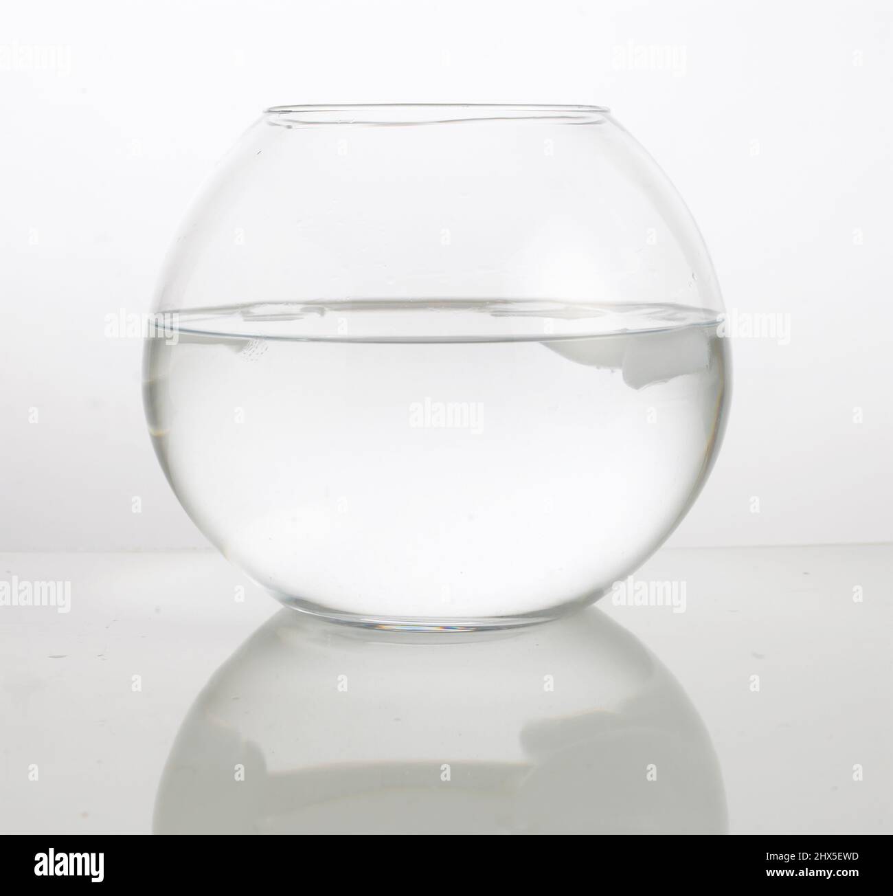 Water and bits of ice in fishbowl Stock Photo