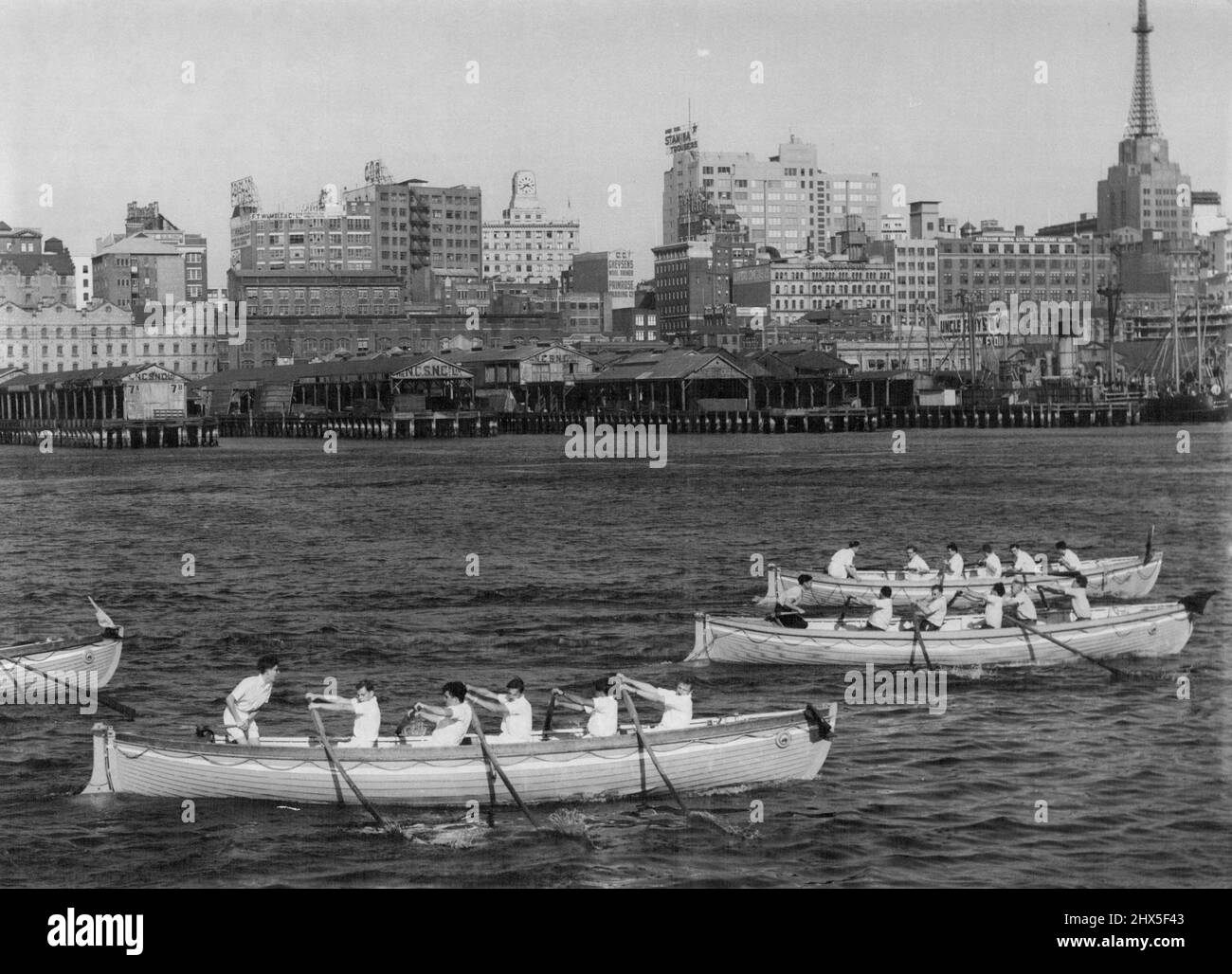 The annual race in Whales for the Orsova Cup was towed at Pyrmont yest. The race was contested by crews from all departments from the R.M.S. Orsova ***** won by the Pontoon pilots identified ratings. October 17, 1955. (Photo by Martin/Fairfax Media). Stock Photo
