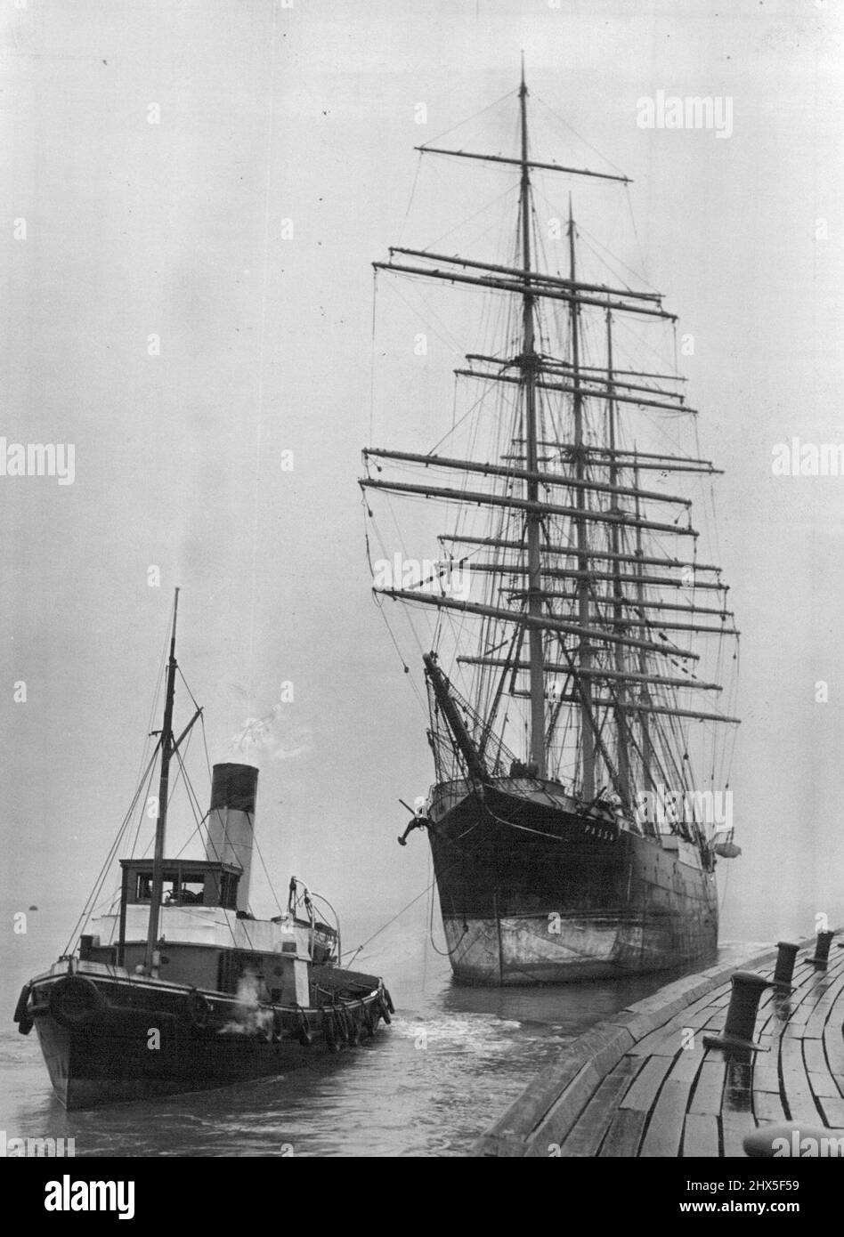 The Passing Of The Old -- The four-masted finnish barque, Passat, one of the last of the windjammers, being toward from Penarth, Glamorgan, Wales. She was destined for Antwerp, Belgium, where she will be broken up, but the tug developed engine trouble and the Passat was delayed at the start. March 07, 1951. (Photo by Paul Popper Ltd.). Stock Photo