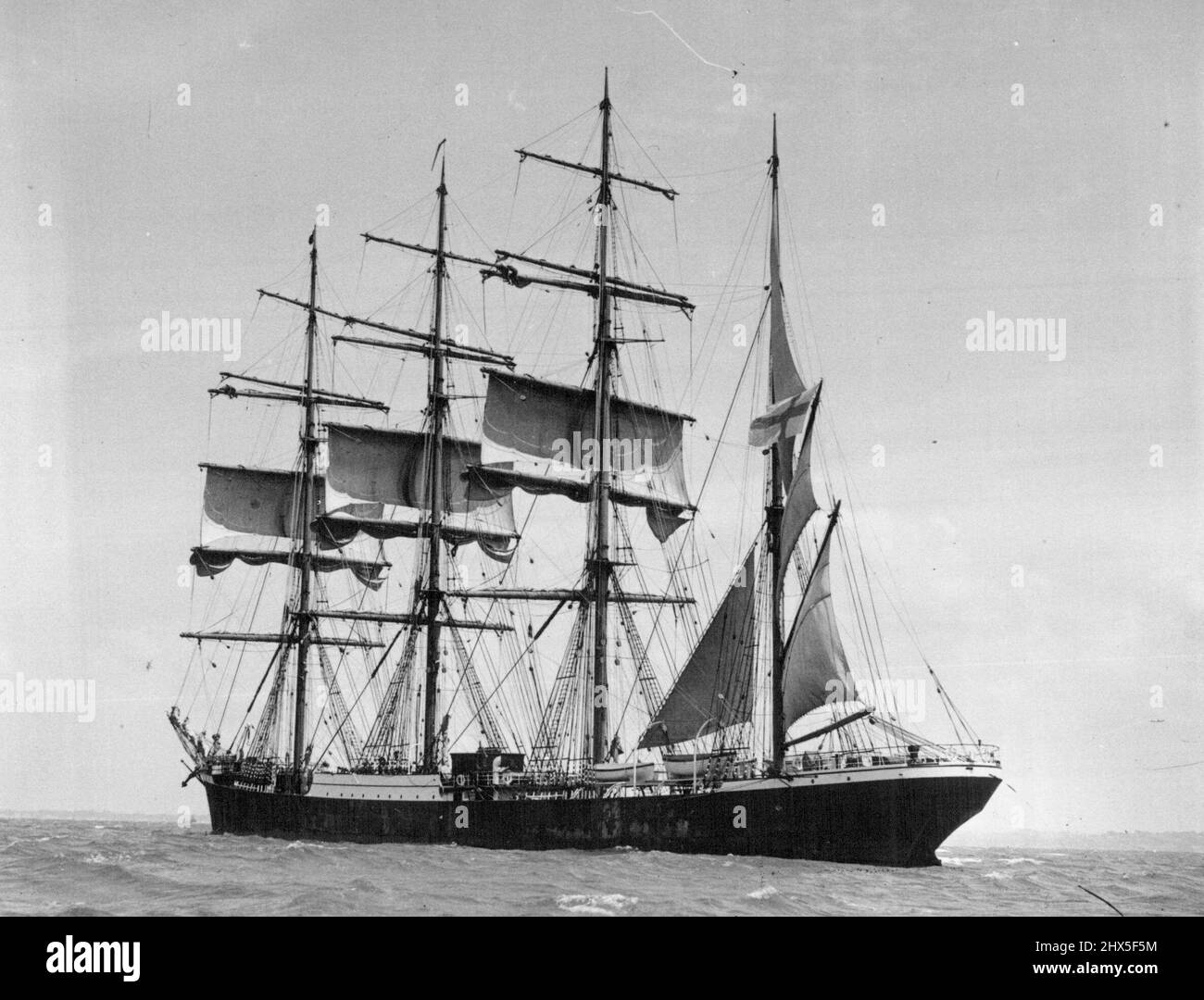 Arrival of the Finnish four-masted barque, Pamir, at Auckland after a voyage of 72 days from the Seychelles Group. Pictures taken as the vessel was shortening sail before entering the harbour and after berthing at King's Wharf. March 11, 1938. Stock Photo