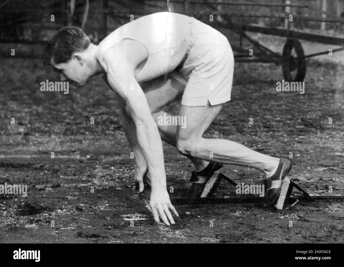 Starting Blocks For Varsity Athletes. T.D. Anderson, Cambridge University hurdler, gets off to a flying starts running training at Fenner's ground, Cambridge, with the new blocks. A new type of starting apparatus, obviating the necessity of 'digging in 1, will be used by Oxford and Cambridge University athletes at their meeting at the White City on Saturday, The Cambridge team are already using it in their training for the event. March 20, 1947. (Photo by Fox Photos). Stock Photo