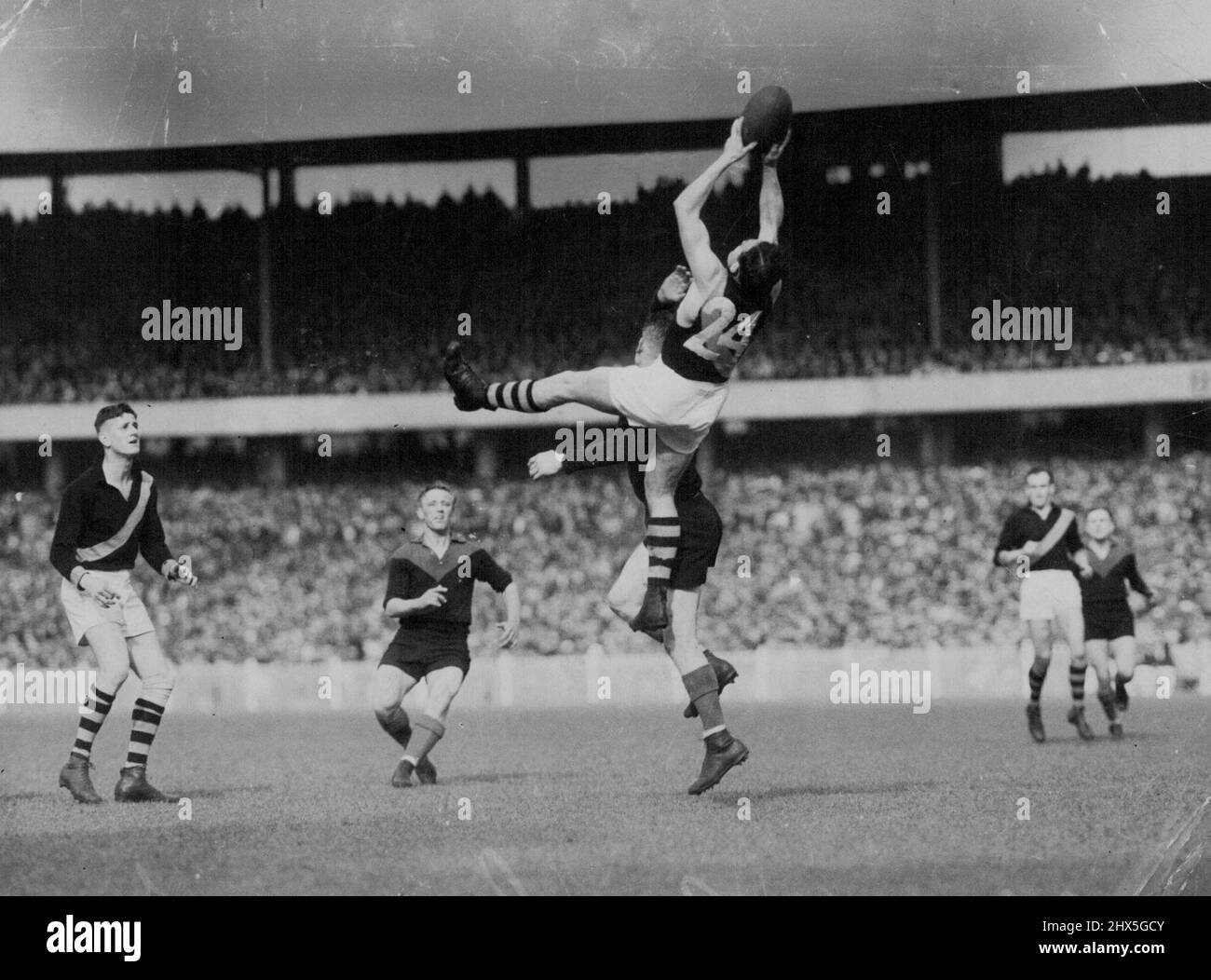 George Smeaton marks. He coached Oakleigh to premiership last season. This is what the fans flock to see a spectator high mark. The professional footballers ***** up your Saturday afternoon entertainment for a poor return are becoming organised in a fight for a bigger share of the rewards. June 25, 1951. Stock Photo