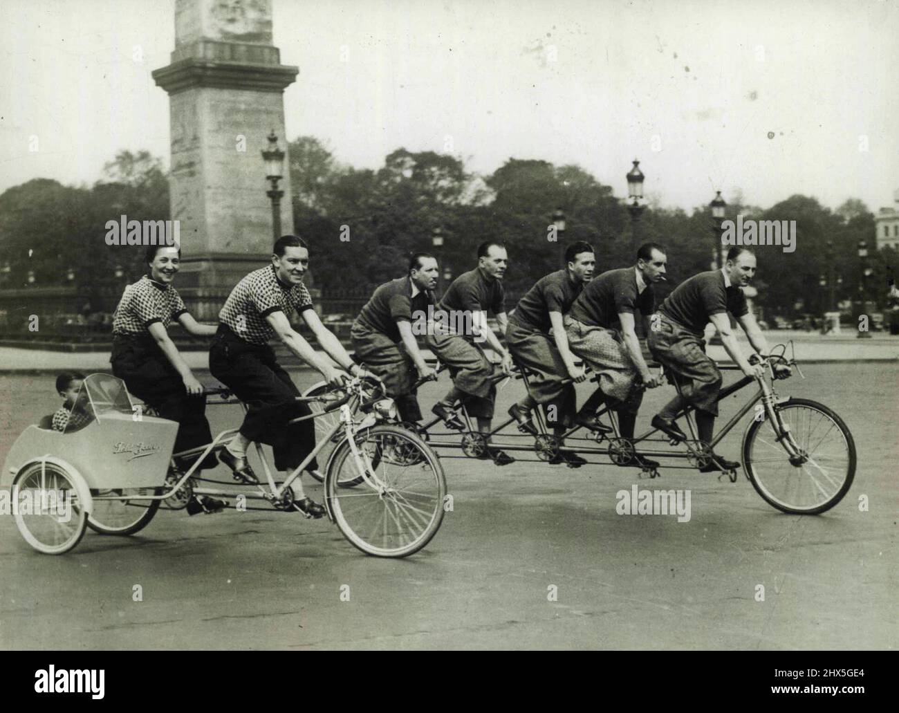 Tandem Day In Paris -- Amongst the numerous entrants in the 'Tandem Day' contest in Paris were these two annual cycling combinations. April 15, 1938. (Photo by Sport & General Press Agency, Limited). Stock Photo