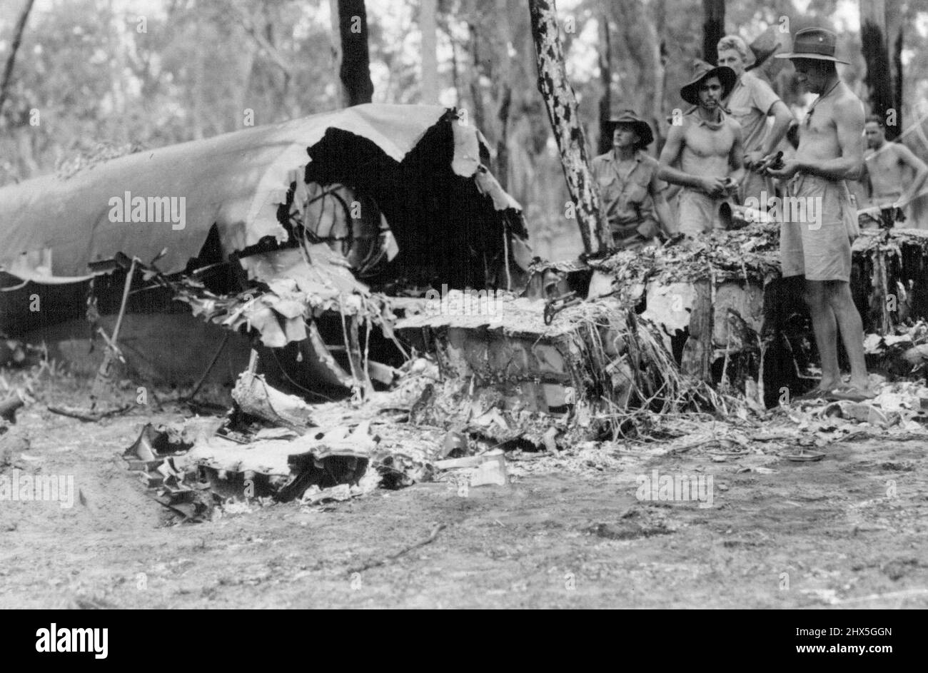 Jap bomber shot down in night raid on Darwin, The bodies of 9 Japanese were found near the wrecked bomber. January 03, 1942. (Photo by Department of Information, Commonwealth of Australia). Stock Photo