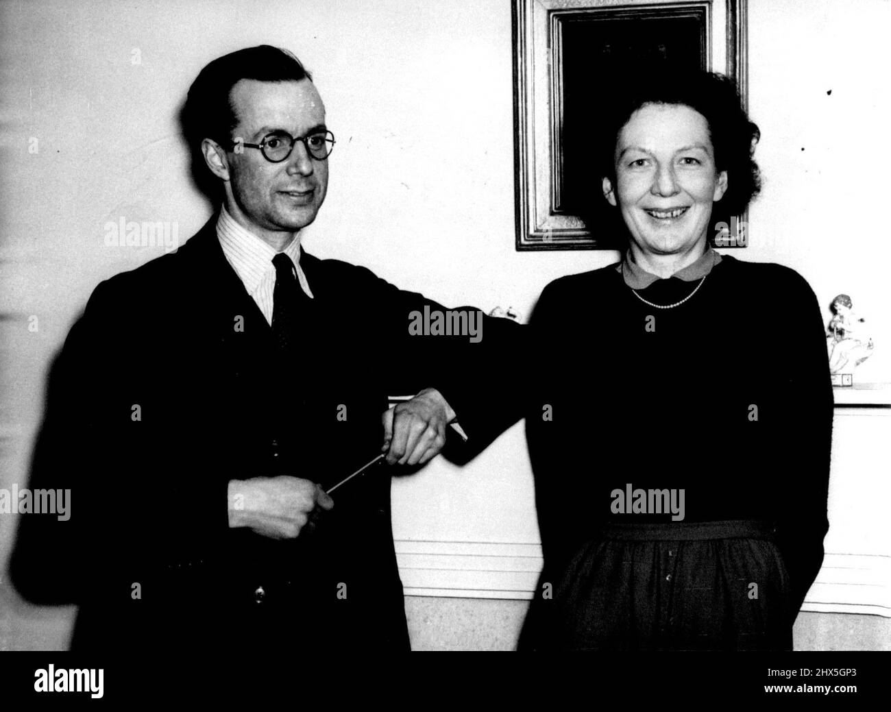 ***** Britain -- Sir Edwin Plowden, photographed with his wife Lady Plowden at their flat. Mr. Attlee announced in the commons to-day ***** Sir Edwin Plowden has accepted she post of the Government's chief planning officer. He is 40 ***** director of ***** and was chief executive of the Ministry of Aircraft production in 1945-46. June 17, 1947. Stock Photo