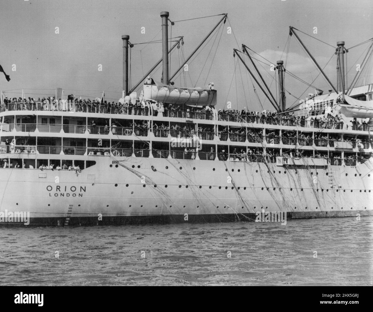 There are 1,600 British migrants on this ship, today steaming in the Indian Ocean towards Fremantle. An ex-M.L.A. on board says there is a crying need for a public relations man on the ship to talk about Australia and the life that lies ahead. But the Immigration Department says it can't afford one. May 6, 1948. Stock Photo