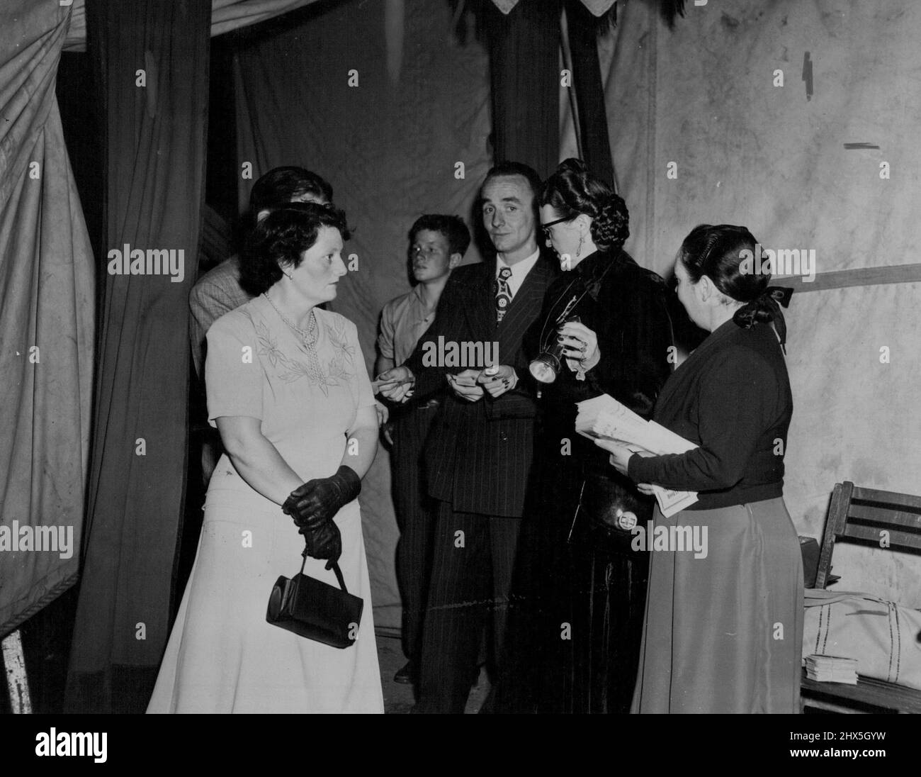 Grace Sorlie has been Charge of the 'front of the house' for years. Her partner ***** she's the 'fastest usherette in the business.' March 12, 1952. Stock Photo