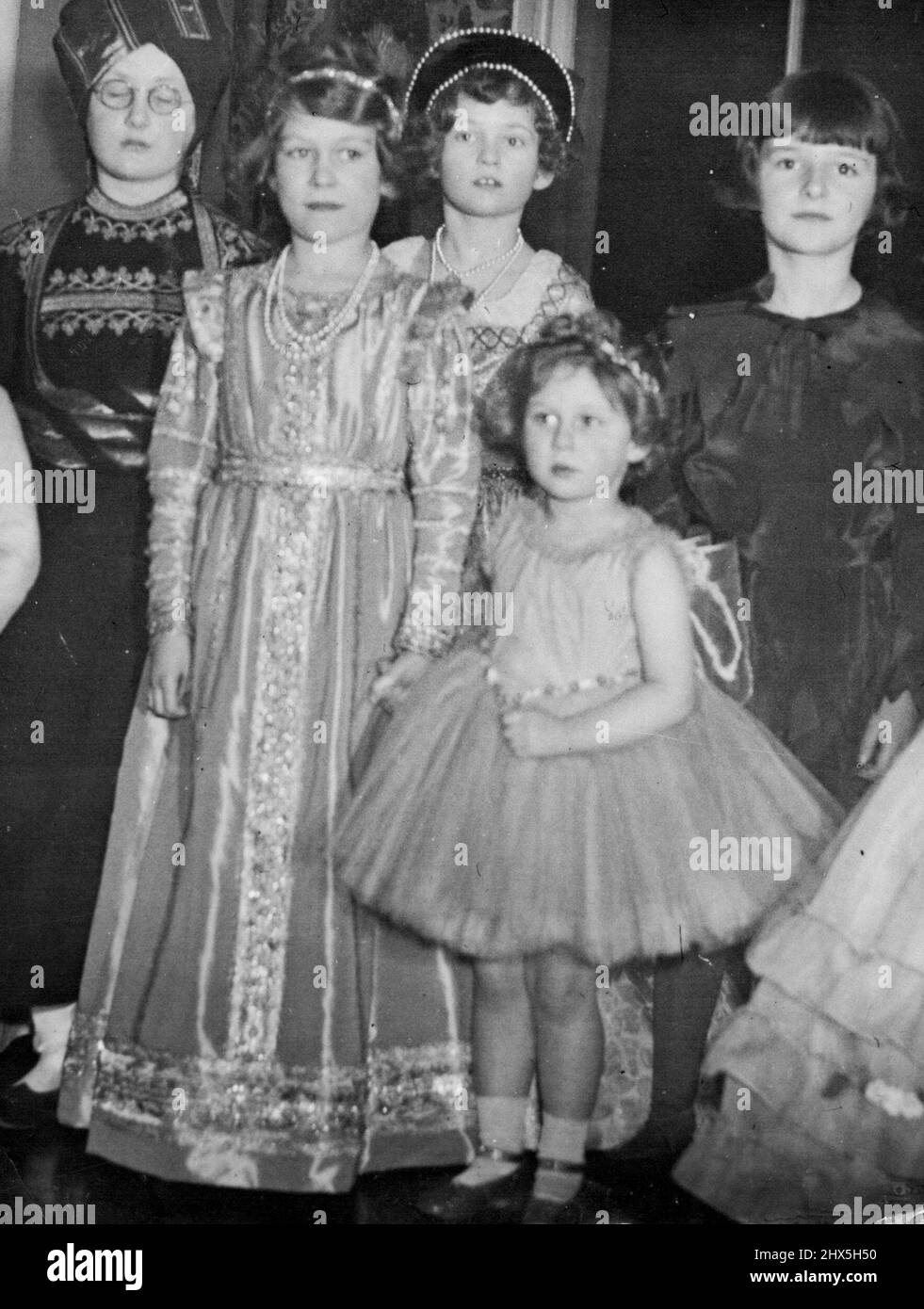 Princess Elizabeth Future Queen Of England Was Almost Eight Years Old. Princess Elizabeth dressed in Tudor costume, photographed with some of her friends at a fancy-dress party given in London by lady Astor, about two months before Princess Elizabeth's eight birthday. November 01, 1945. Stock Photo