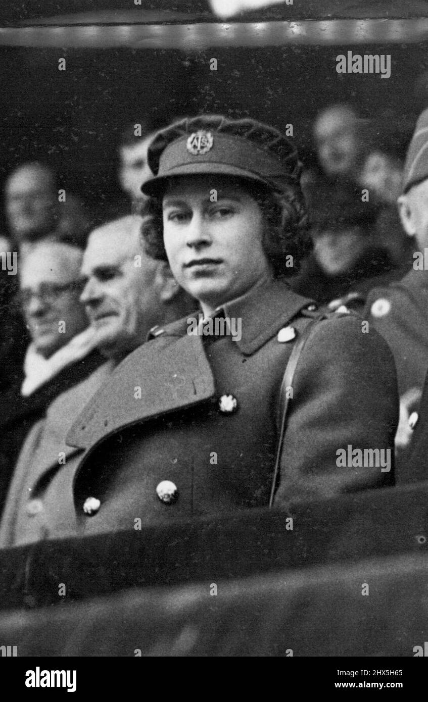 ***** And Queen At Cup Final. H.R.H. Princess Elizabeth in A.T.S. uniform. The King and Queen accompanied by Princess Elizabeth attended the Chelsea V Millwall South Cup Final at Wembley. June 4, 1945. (Photo by L.N.A.). Stock Photo