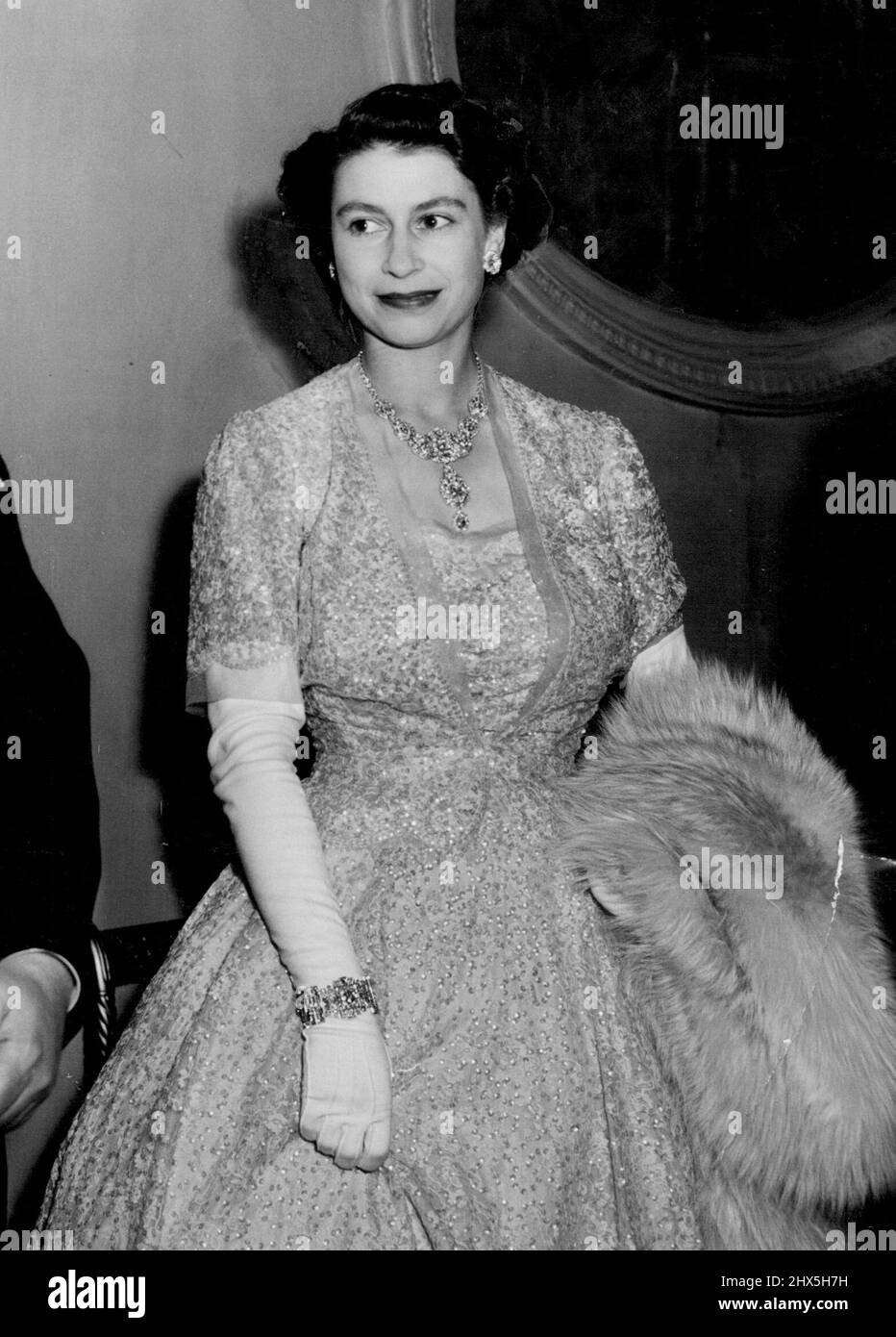Princess At The Ballet. Princess Elizabeth, in a striking crinoline gown, pictured when with the Queen, she attended a gala performance of Frederick Ashton's new ballet 'Tiresias' at the Royal Opera House, Covent Garden. The performance was held in aid of the Sadler's Wells Ballet Benevolent Fund. July 9, 1951. Stock Photo