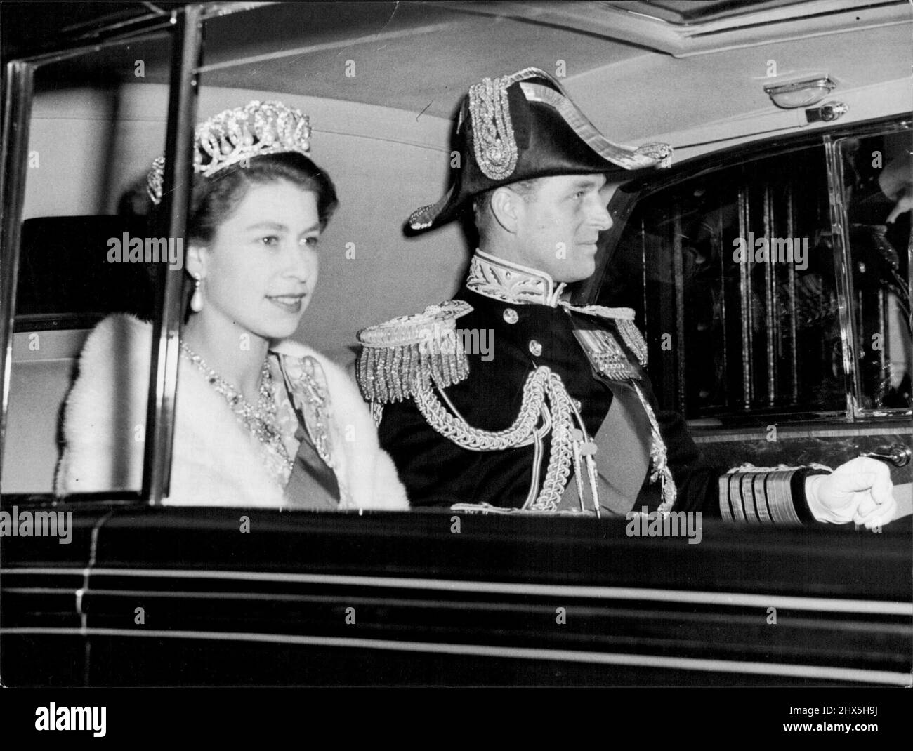 Duke Wears His Admiral's Cocked Hat - Drive From Palace With Queen The Queen and the Duke of Edinburgh, who wears his Admiral's cocked hat, drive from Buckhingham Palace to-night (Friday) to attend the dinner given by the Prime Minister at Lancaster House, St. James, London. June 5, 1953. (Photo by Reuterphoto). Stock Photo
