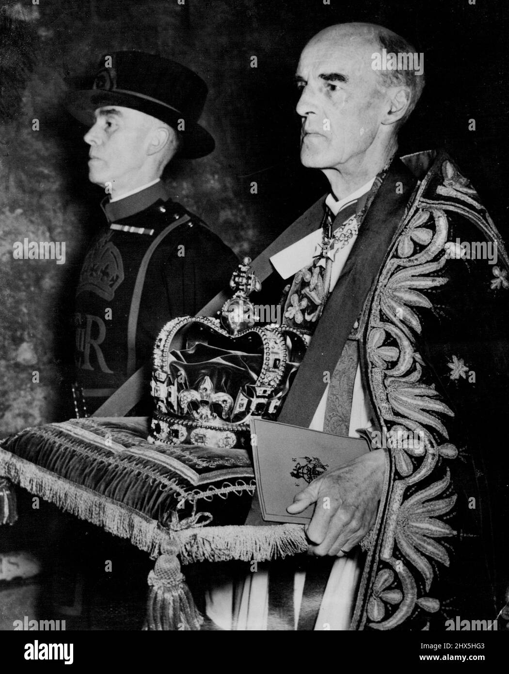 The Coronation Crown -- The Dean of Westminster, Dr. Don bears St. Edwards Crown in the Regalia Procession in Westminster Abbey this morning where Queen Elizabeth II was being crowned. June 02, 1953. (Photo by United Press Photo). Stock Photo