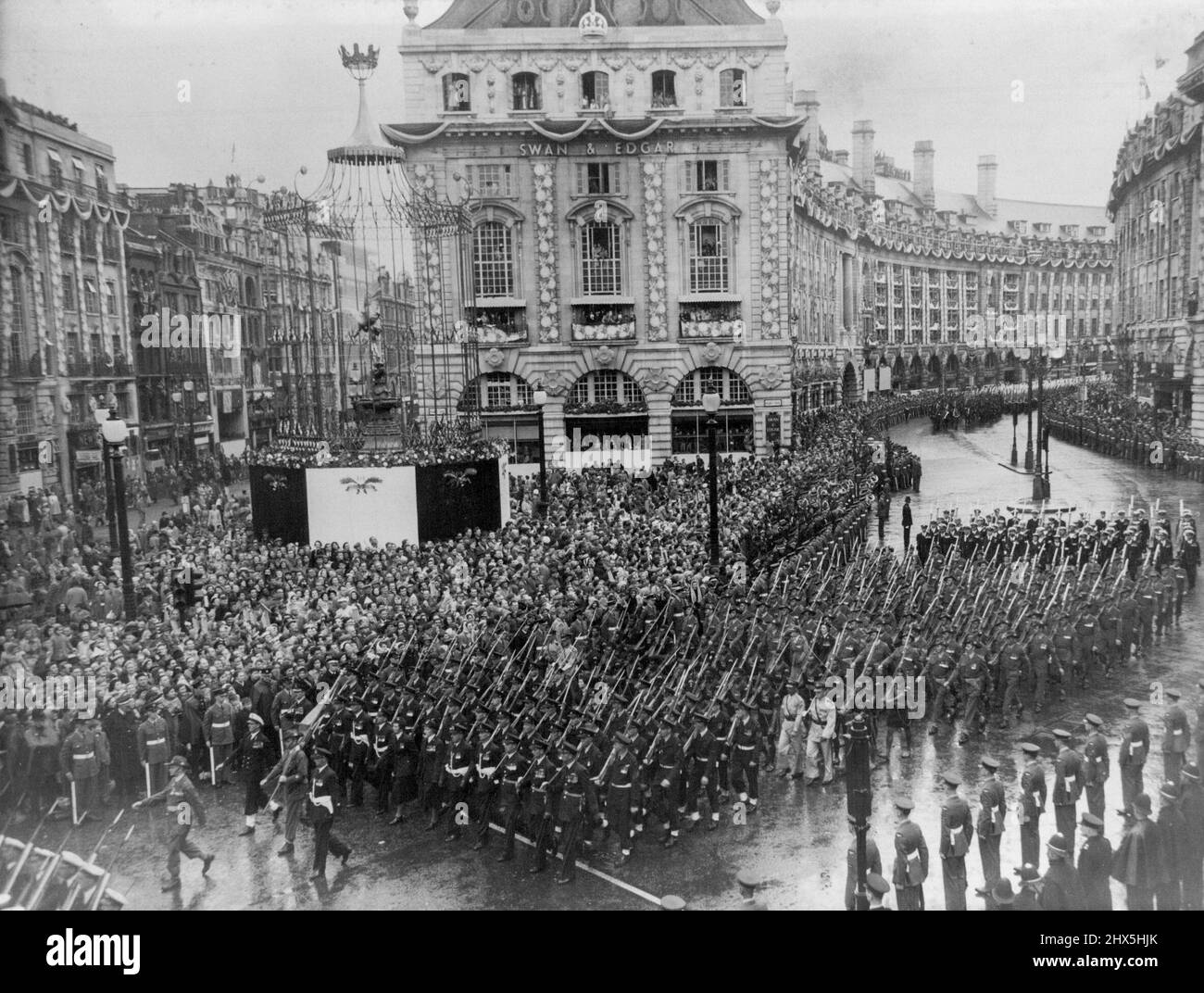 The Coronation Procession -- The Australian contingent marching through Piccadilly Circus in the Coronation procession on it way back to Buckingham Palace from Westminster Abbey after the Coronation ceremony to-day June 2. June 10, 1953. Stock Photo
