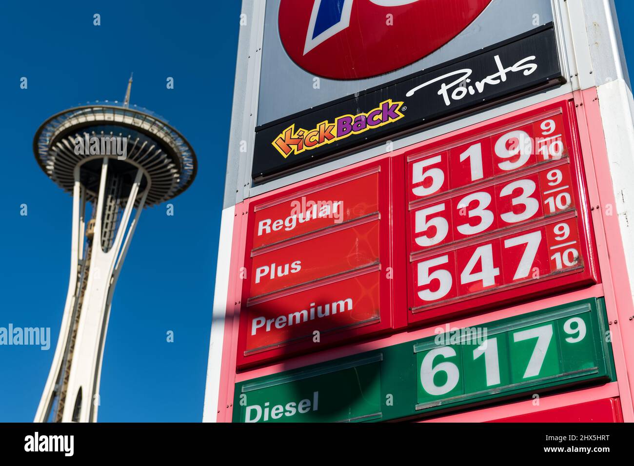 Seattle, USA. 9th Mar, 2022. Pain at the pump in the shadow of the Space Needle on Denny way. Unleaded fuel breaching the five dollar a gallon mark. Gas prices are still surging across the United States after Russia’s invasion on Ukraine on the 24th of Feb. Struggling Americans are dealing with skyrocketing inflation and increasing rents as Covid-19 restrictions lessen and the world opens up. James Anderson/Alamy Live News Stock Photo