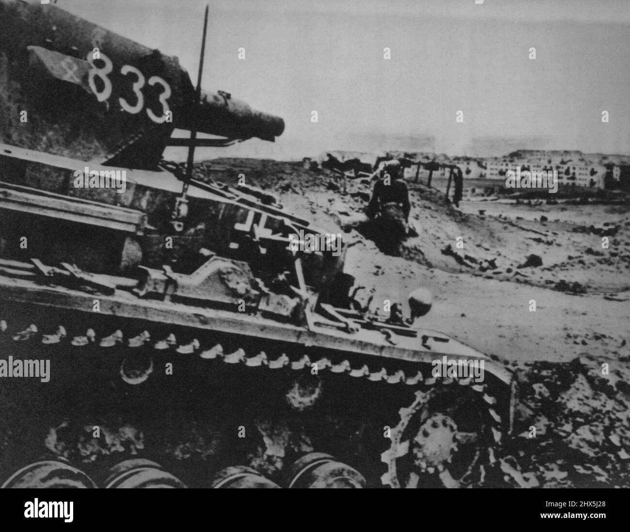 Pointing Toward Stalingrad -- The gun on this Nazi tank toward Stalingrad as the armored vehicle supported an advance German infantry against Soviet fortifications in the Volga industrial city, according to the caption accompanying this German photo ***** reached New York from neutral Portugal. December 5, 1942. (Photo by AP Wirephoto). Stock Photo