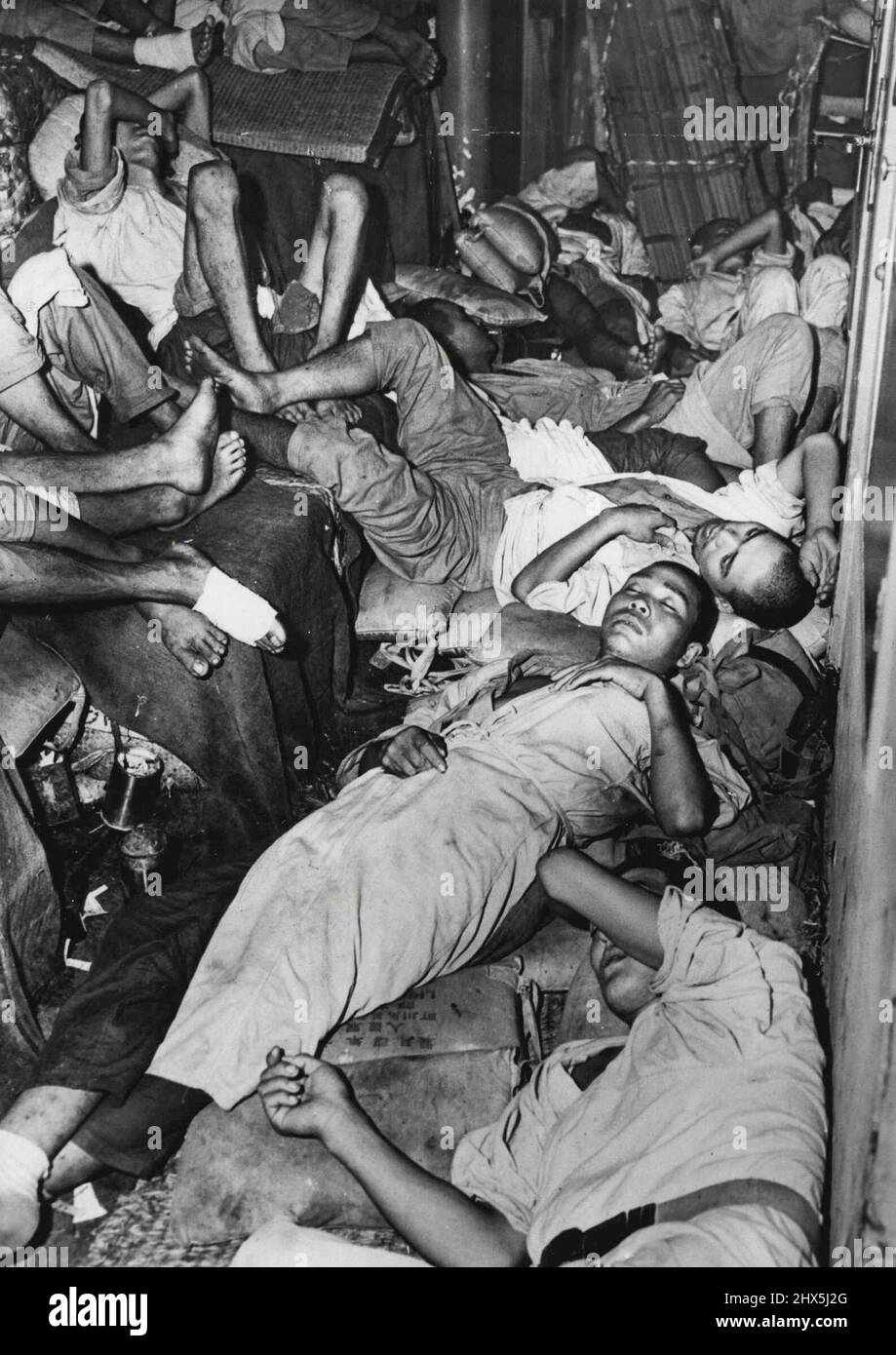 Treachery: Some of the 1560 Japanese 'patients' - mostly fit-discovered crammed into the fake Jap hospital ship, Tachihama Maru off Java on August 3. August 17, 1945. Stock Photo