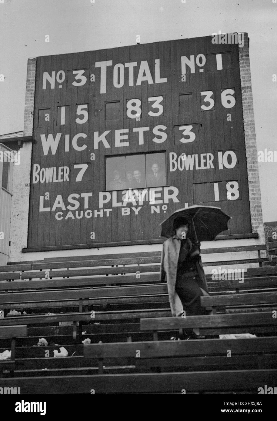 Cricket At Sheffield - Only 67 Runs Wanted For Victory By Yorkshire - Then Rain Stops Play -- A lone spectator beneath the dramatic score-board at Sheffield yesterday, which shows how near Australia were to defeat. The prospect of the first defeat of the tour and the first beating by a county side since 1912 for the Australians was the outstanding topic in cricket yesterday. Yorkshire, the champion county, with all their second wickets in hand, needed 150 runs to beat the Australians, when play was resumed on a damp wicket at Sheffield yesterday. July 6, 1938. (Photo by Topical Press). Stock Photo