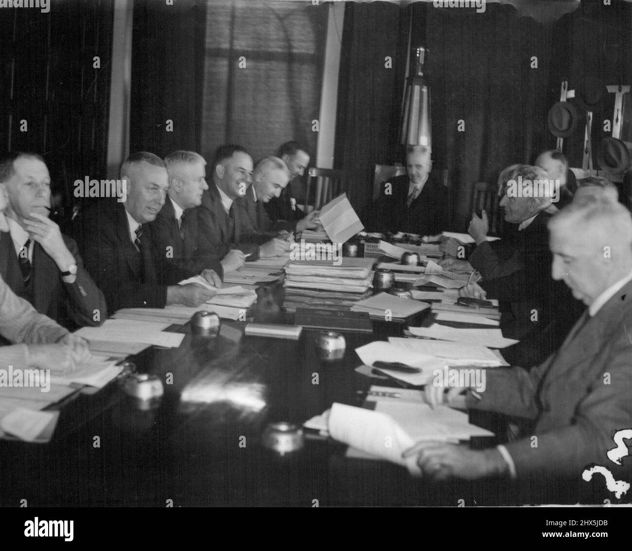 Australian Cricket 'Parliament,' the Board of control, in session in the V.C.A. Building today. There have been elaborate preparations for this important meeting which faced an agenda with more than 70 items. From left (round the table): Messrs. Clem Hill (S.A.), R. F. Middleton (S.A.), H. W. Hodgetts (S.A.), K. O. Johnstone (N.s.W.), R. A. Oxlade (N.S.W.), F. M. Cush (N.S.W.), the chairman (Dr. Allen Robertson), the secretary of the Board and Manager of the team (Mr. W. H. Jeanes (S.A..), the acting-secretary, ( Mr. H. Heydon, N.S.W.), Dr. R. L. Morton (Vic.), and Messrs H. A. Bussell (Vic.) Stock Photo
