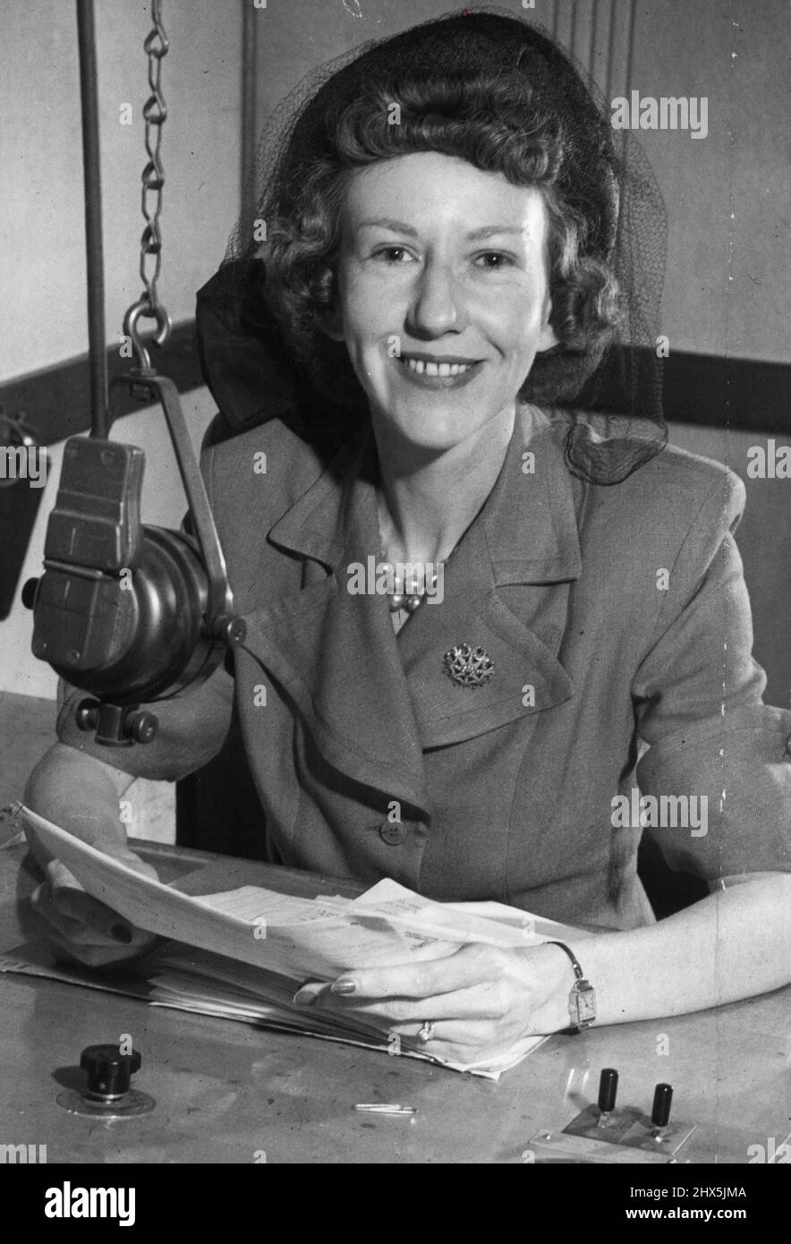 Miss Eileen Powell is sandwiching in her electioneering with her job as