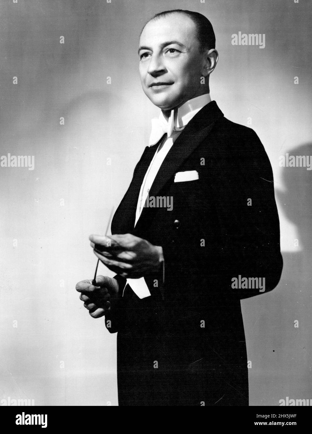 Joseph Post, Associate Conductor of the Sydney Symphony Orchestra will conduct at the ABC's free concert in Sydney Domain on Sunday night at 8.30pm the concert will mark the end of Jubilee year. January 2, 1952. (Photo by George Glover, Photo-Recording Studios). Stock Photo