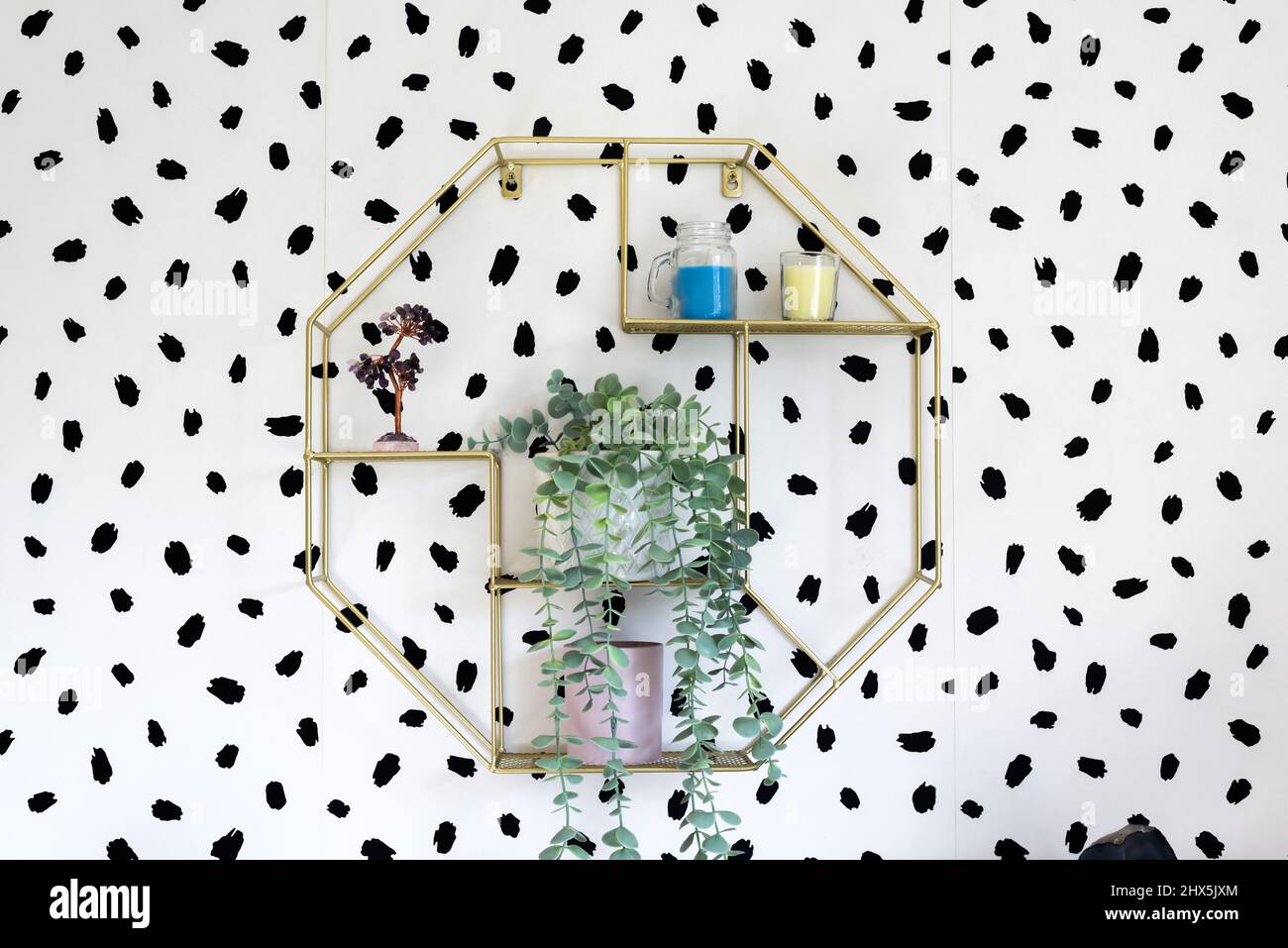 Simple shelving unit with ornaments in modern home interior Stock Photo