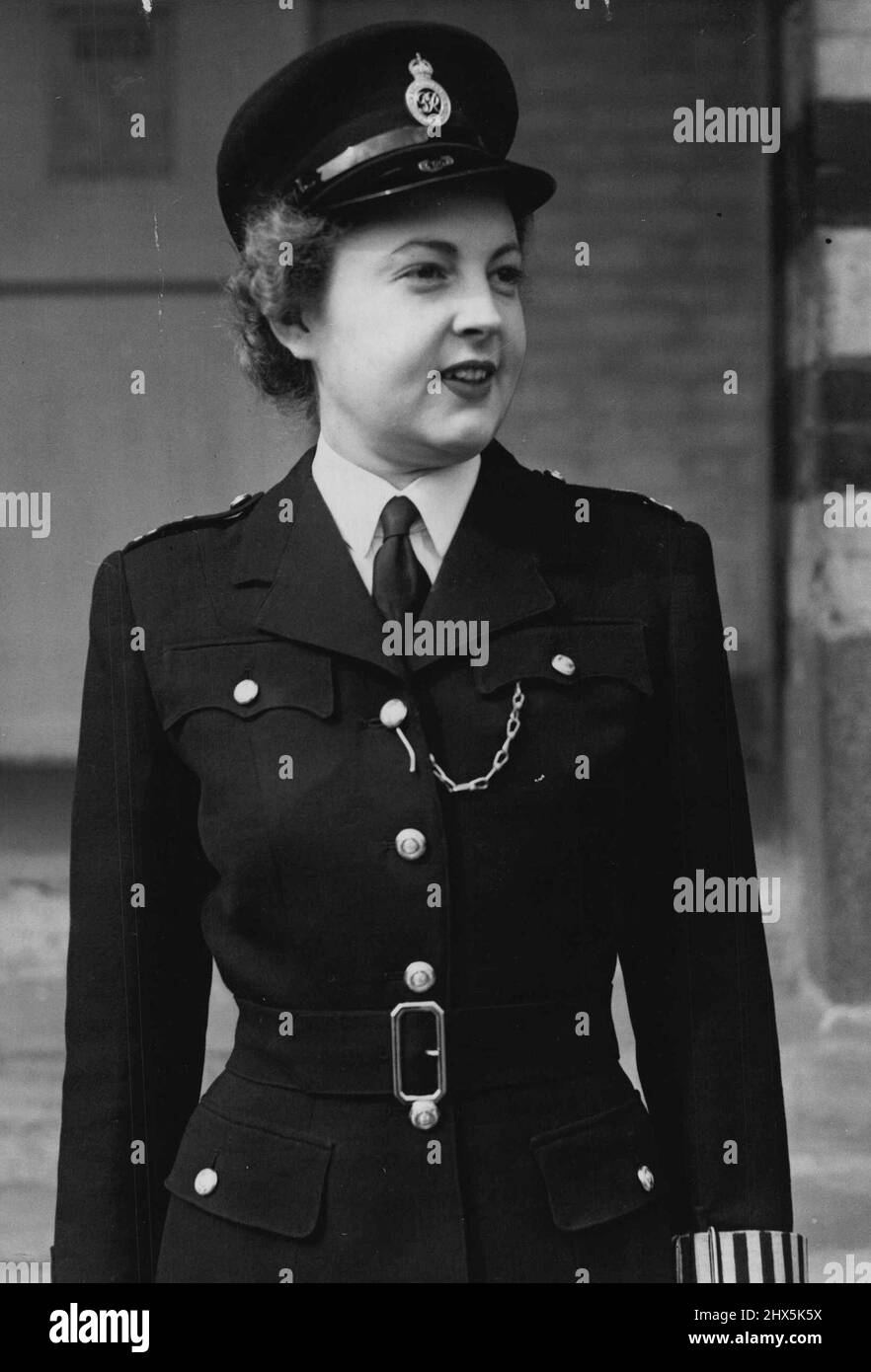 Star of the Beat Wears New Policewomen's Uniform Police Officer Dorothy Shepherd pictured wearing the new uniform as she left for duty this morning (Friday). Police officer Dorothy Shepherd, who stars in a police recruiting film which is to be shown publicly in the late summer, was out on duty to-day (Friday) wearing the recently-introduced new uniform for London's policewomen. The new tunic is on the style of those worn by American policewomen, and the greatcoat follows service lines, with silver buttons in place of the old black ones. May 6, 1947. (Photo by Reuterphoto). Stock Photo