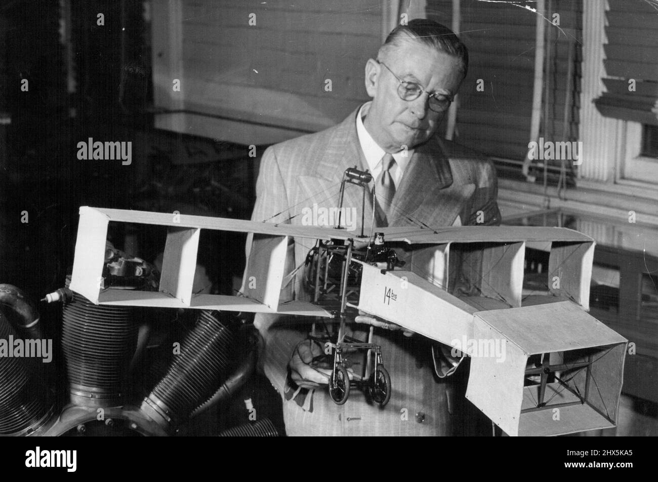 Roughley, also a student of aerodynamics, holds a model of the first ...