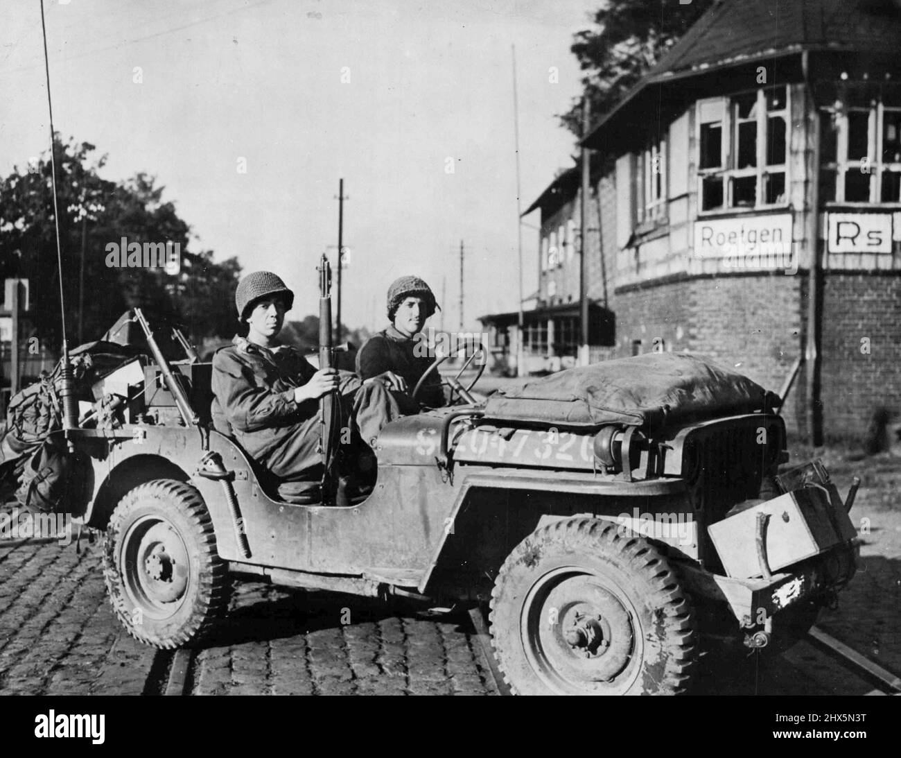 Americans Pierce Siegfried Line in Roetgen Area: The first American jeep to cross the German frontier stops at the railroad station in Roetgen September 14, 1944. American forces blasted a path through the outer concrete and steel fortifications of the Siegfried line in the vicinity of the German city a few miles inside the border. October 23, 1944. (Photo byU.S. Signal Corps Photo). Stock Photo